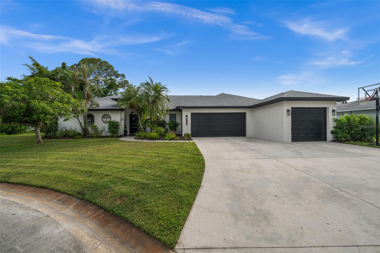 WOW! This stunning 4-bedroom, 3-bath, 3-car garage split-plan pool home is perfectly situated near the end of a quiet cul-de-sac. Completely remodeled from top to bottom and beautifully designed in a modern contemporary style!
Enjoy exceptional living space with a formal living and dining area, plus a gorgeous new kitchen that opens to a large family room with a modern electric fireplace and casual dinette area.
The spacious master suite offers a luxurious bath with a freestanding tub, oversized walk-in shower with dual rain heads, and double vanities. Bedroom 2 includes its
 own ensuite bath that also serves as the pool bath, while Bedrooms 3 and 4 share a well-appointed bath.
Step outside to your private backyard with a refinished pool and rescreened pool cage, perfect for relaxing or entertaining. The 3-car garage provides plenty of room for vehicles and storage. Newer roof AC and irrigation system. Located near top-rated schools, golf course views. This home truly checks all the boxes!