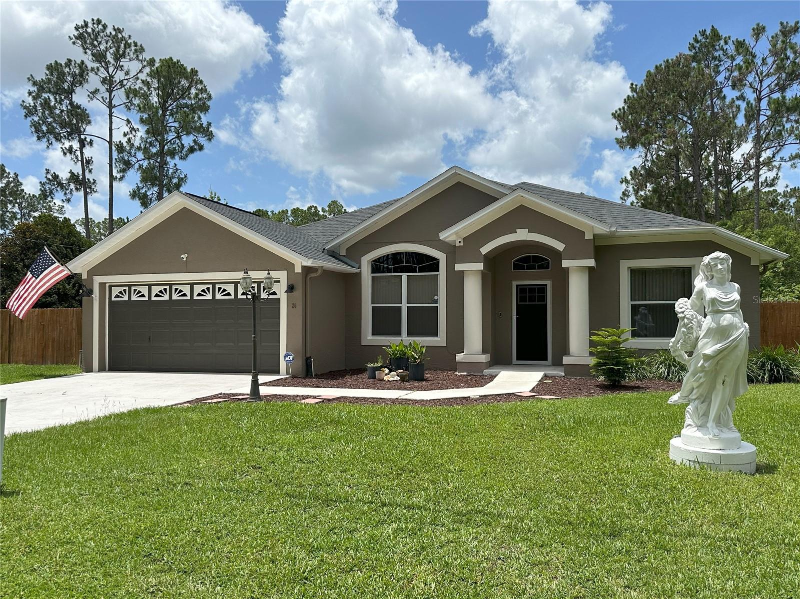 There's plenty of space inside and outside of this 5 Bedroom, 2 Bath home built in the middle of 2 (TWO!) lots that are FULLY FENCED! And it's all ideally located in the Quail Hollow subdivision of Palm Coast, which is close to US 1, US 100, I-95, and many of the hottest retail properties in Flagler County, including Shopping, Dining and Entertainment, as well as Doctors & Hospitals, Recreation, Parks, and our beautiful Florida BEACHES! WOOD LAMINATE, TILE and SLATE FLOORING can be found throughout this spacious single story home, with a FORMAL DINING ROOM or LIVING ROOM at the entrance (your choice), and an OPEN KITCHEN that has tons of COUNTERTOP SPACE, CABINETS with PULLOUTS, a CLOSET PANTRY, and a BREAKFAST BAR that seats up to 8. The GUEST BEDROOMS are generously-sized, and the MASTER BEDROOM has a huge WALK-IN CLOSET, a separate WALK-IN SHOWER and TUB, and a VANITY with a GRANITE COUNTERTOP. The FAMILY ROOM looks out onto a MASSIVE 667 sq. ft. TILED FLORIDA ROOM, perfect for relaxing and unwinding after a long day. Additional attributes include the TWO FENCED YARDS with green lush lawns, a METAL GAZEBO, a GARDEN/UTILITY SHED, and lots of room for outdoor adventures. The SHINGLE ROOF was replaced in 2020, and the FENCING was installed in 2017.
