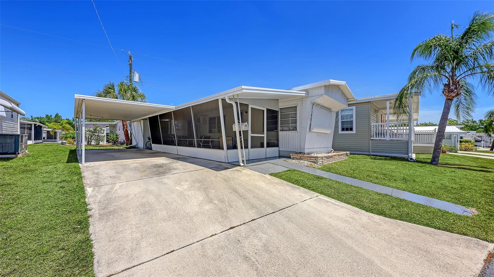 Welcome to an incredible opportunity in the highly desirable Southwind's 55+ co-op community, ideally located in the heart of Sarasota just minutes from the world-renowned Siesta Key Beach. Whether you’re searching for a full-time residence, seasonal getaway, or investment opportunity, this property offers exceptional value in an unbeatable location. This one-bedroom, one-bath residence features a spacious and functional layout with abundant natural light throughout. The living area flows nicely, creating a comfortable and inviting space to relax or entertain. One of the standout features is the oversized lanai; perfect for enjoying the Florida lifestyle year-round and easily serving as additional living space. The home also offers a private driveway, a dedicated laundry area located in the shed, and ample storage space. While the unit could benefit from some updating, it is priced accordingly, presenting a fantastic opportunity to customize and make it your own. With a little vision, this property has the potential to truly shine; making it especially appealing for investors or buyers looking to add value. Located in an X flood zone, this property has had no flood or water damage from recent storms, offering added peace of mind. Southwind is a vibrant and friendly community known for its active lifestyle and impressive amenities, including a heated pool, shuffleboard courts, horseshoe pits, library, and recreation hall. The community also offers guest parking along with designated areas for RV and boat storage. With low monthly fees of just $195, which include water, sewer, cable, and lawn care, it’s one of the best values in Sarasota. Conveniently located just 10 minutes to Siesta Key, 20 minutes to downtown Sarasota and UTC Mall, and close to shopping, dining, and everything South Sarasota has to offer. Affordable opportunities like this in such a prime location are rare. Priced to sell and offered as-is with the right to inspect; don’t miss your chance to make this your own slice of paradise.