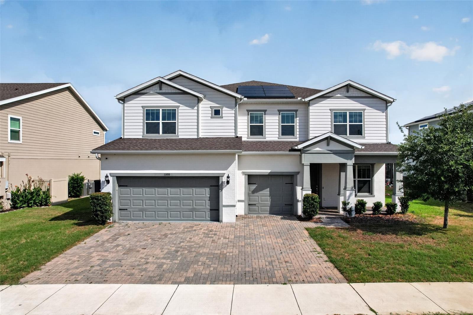 Experience luxury waterfront living in one of Winter Garden's most desirable communities! This stunning home offers the perfect blend of elegant design, spacious living, and breathtaking water views. From the moment you arrive, you'll appreciate the attractive curb appeal, paver driveway, and spacious three-car garage.

Inside, you'll find an expansive open floor plan designed for both everyday living and entertaining. The heart of the home is the impressive chef's kitchen featuring an oversized quartz island, built-in wall oven and microwave, stainless steel appliances, abundant cabinetry, a walk-in pantry, and plenty of prep space. The kitchen flows seamlessly into the spacious family room, highlighted by beautiful luxury flooring, tray ceilings, decorative wall accents, and oversized sliding glass doors that frame the picturesque lake views.

The first-floor primary suite is a true retreat, offering private access to the screened lanai, generous proportions, and a luxurious ensuite bath complete with dual vanities, an oversized walk-in shower, private water closet, and an expansive walk-in closet.

Step outside to the oversized screened lanai and enjoy your morning coffee or evening sunsets overlooking the peaceful water. The backyard offers plenty of room to relax while taking in the tranquil views.

Additional features include a large laundry room, spacious secondary bedrooms, ample storage throughout, modern neutral finishes, and dual HVAC systems for added comfort and efficiency.

Located in the highly sought-after Winter Garden area, you'll enjoy easy access to shopping, dining, entertainment, and major roadways including SR-429, Florida's Turnpike, and Highway 50. Historic Downtown Winter Garden, Winter Garden Village, Horizon West, and Disney are all just a short drive away. The community also offers convenient access to parks, walking trails, and everything that has made Winter Garden one of Central Florida's most desirable places to call home.

If you've been searching for a spacious, move-in-ready waterfront home with upscale finishes and an exceptional location, this one deserves a spot at the top of your list.
