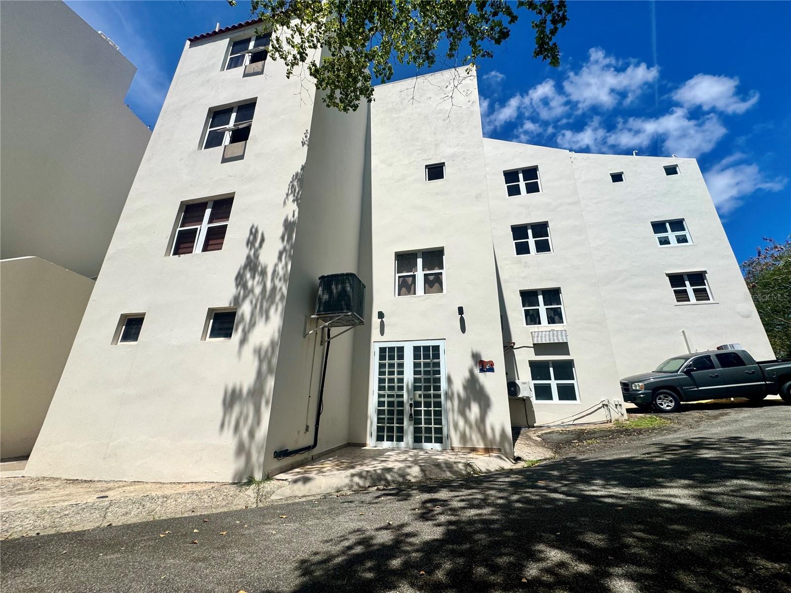 Opportunity awaits in Palmas del Mar with this spacious two-story ground-level townhouse located in Palmarina Club community. Offering approximately 2,011 sq. ft., this 3-bedroom, 2.5-bath residence presents the perfect opportunity for buyers looking to customize and renovate a property to their own taste and style.
Sold “as is,” this fixer-upper features an expansive living area with direct access through French doors to a private open terrace, creating excellent potential for indoor-outdoor living and entertaining. The first floor also includes a convenient laundry room and generous common areas with endless possibilities for redesign and upgrades.
Upstairs, the primary suite offers partial marina views from its private balcony, along with a walk-in closet, ensuite bathroom, and jacuzzi area. The property includes one covered garage parking space, with an additional parking space available.
Residents of this gated community enjoy access to a community pool and playground, all within close proximity to the marina, restaurants, and resort amenities that make Palmas del Mar one of Puerto Rico’s most sought-after coastal communities.
With its oversized layout, prime location, and strong renovation potential, this property is an excellent opportunity to create a truly exceptional residence or investment property.