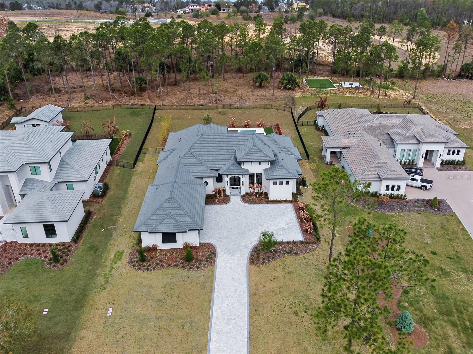 Located in the exclusive gated community of Bella Collina, this stunning Savannah model by Davila Homes offers luxury living surrounded by the rolling hills of Montverde. This beautifully designed residence features 4 bedrooms, a private office, and a spacious 4-car garage, combining elegance with modern functionality. The open-concept layout is filled with natural light and high-end finishes throughout, creating an inviting space perfect for both everyday living and entertaining. Step outside to your private outdoor retreat featuring a resort-style pool and spa with a fully equipped summer kitchen, ideal for enjoying Florida’s year-round outdoor lifestyle. Residents of Bella Collina enjoy world-class amenities including a championship golf course, luxury clubhouse, spa, fitness center, tennis courts, and fine dining at The Club at Bella Collina. Conveniently located just minutes from the Florida Turnpike with easy access to Orlando, Winter Garden, and area attractions. An exceptional opportunity to own a luxury home in one of Central Florida’s most sought-after communities.