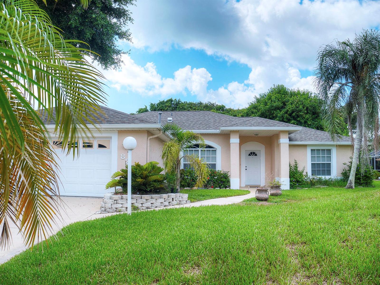 Just blocks to the beach, this 3 bedroom 2 bath pool home features an open floor plan and over 1800 square feet of living space.  The expansive kitchen offers a built in pantry for lots of storage space, breakfast bar that seats 3-4, and an adorable breakfast nook that overlooks the sparkling pool from a bay window. French doors from the large living room gives access to the enclosed patio bathed in natural light from surrounding windows. Perfect for entertaining or just relaxing, the pool, built in spa with fountain and outdoor living area are screened-in and partially shaded with beautiful mature foliage. Other features include an indoor utility room complete with utility sink, an over-sized 2 car garage, walk-in closet, and high vaulted ceilings which give the entire home a bright cheerful feeling. All just blocks to all central New Smyrna has to offer including shopping, dining, and reveling in the sunrises over the Atlantic Ocean. ;Water: City