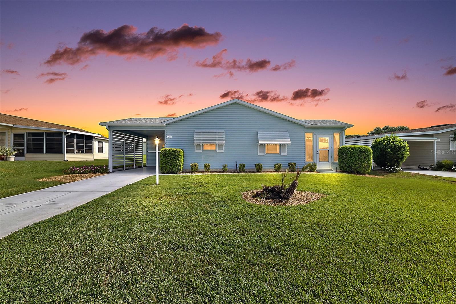 Discover Florida living at it’s best in this FABULOUS, partially FURNISHED, 2-bedroom 2-bath home featuring an ENCLOSED LANAI, SPACIOUS CARPORT with horizontal PRIVACY fencing, rear PRIVACY LANDSCAPING, and a combination INTERIOR LAUNDRY and STORAGE ROOM - perfectly nestled in the quaint Village of Del Mar! - JUST MINUTES from Spanish Springs Town Square with shopping, dining, and live nightly entertainment! NO BOND or CDD! HVAC (2022) A DECORATIVELY PAINTED DRIVEWAY, SPACIOUS CARPORT, and French door entry welcome you in to the OPEN-CONCEPT layout showcasing VAULTED ceilings and GORGEOUS wood grain LUXURY VINYL PLANK flooring that flows seamless throughout the ENTIRE HOME! The BRIGHT kitchen showcases WOOD cabinetry with ROLL-OUT shelving, NEUTRAL countertops, and STAINLESS steel appliances. The adjoining dining and living rooms boast multiple windows and a set of sliding glass doors that bathe the home in NATURAL LIGHT. From the living room, step through sliding glass doors into the GLASS-ENCLOSED LANAI, creating the perfect extension of the home’s living space. This light-filled retreat features EXPANSIVE WINDOWS and PLANK TILE FLOORING for both durability and low-maintenance convenience. Whether enjoying your morning coffee or hosting guests, this beautifully designed space offers the perfect blend of comfort, functionality, and indoor/outdoor charm! Back inside, the primary bedroom boasts a VAULTED CEILING, LARGE window, and a GENEROUS WALK-IN CLOSET. Its en-suite bathroom features LIGHT-WOOD cabinetry with a NEUTRAL top, SOLAR TUBE, and a WALK-IN shower. The second bedroom also features a VAULTED CEILING, LARGE window, and a built-in closet and offers the perfect space for additional sleeping, den, or a hobby room. The well-appointed second bathroom has a LIGHT WOOD vanity with a NEUTRAL top, SOLAR TUBE, and a tub and shower combination. Adjacent to the CARPORT is a separate 140sf INDOOR UTILITY ROOM with a CONVENIENT LAUNDRY AREA with shelving and PLENTY of space for STORAGE! Additional UPGRADES include SOLAR PANELS that provide energy-efficiency and savings, Safety Zone WHOLE-HOUSE WATER FILTRATION SYSTEM, updated breaker box, and also a house re-pipe! DON'T MISS YOUR OPPORTUNITY to make this WONDERFUL HOME YOUR OWN! The Village of Del Mar is IDEALLY LOCATED JUST MINUTES from Spanish Springs Town Square with shopping, dining, and live nightly entertainment! Close to Hacienda Hills Championship Golf and Country Club; Chula Vista and Silver Lake Executive Golf Courses; La Hacienda Regional Recreation Center; and Chula Vista, Silver Lake, and Rio Grande Pools and Recreation Centers; Also, ONLY MINUTES from Hwy 441/27 and CR 466 featuring an abundance of stores, restaurants, banks, medical, and more! PLEASE WATCH OUR WALKTHROUGH VIDEO of this FANTASTIC HOME in a FABULOUS LOCATION and call today to schedule your Private Showing or Virtual Tour!