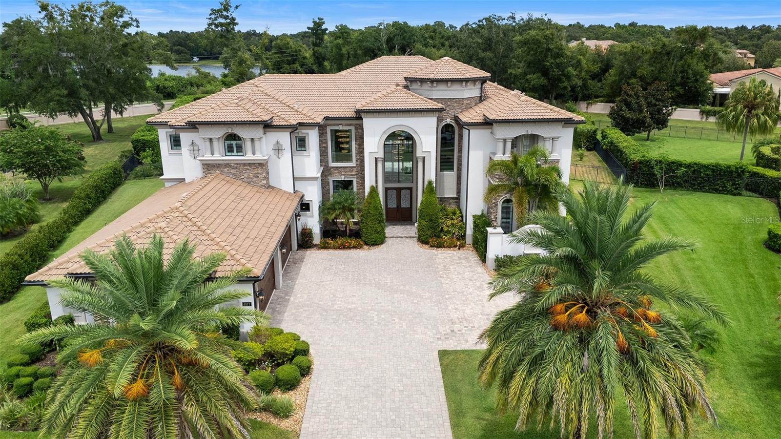 One or more photo(s) has been virtually staged. Stunning contemporary estate on over 1 acre in guard-gated Casabella. This 6-bedroom, 6 full bath, 2 half bath custom home offers over 7,500 sq ft of luxurious living. Open-concept design with soaring ceilings, walls of glass, and high-end finishes throughout. Gourmet kitchen with extended islands, premium appliances, and seamless flow into the great room and formal dining. First-floor primary suite with spa-like bath and custom closets. Each secondary bedroom includes an en-suite bath. Additional highlights include a home office, media room, and theatre room. Expansive backyard with resort style  pool and outdoor kitchen. Smart home features, 4-car garage, and prime location near top-rated schools, golf, and amenities.