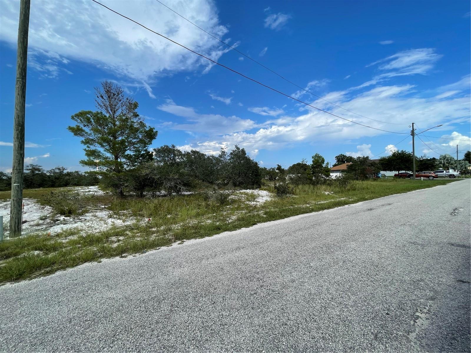 This lot is situated in the well-established Sun Ray neighborhood, conveniently close to various amenities, including public boat ramps for Lake Reedy and Lake Clinch. It’s also just a 30-minute drive from Bok Tower Gardens and Legoland. Please note that all measurements and sizes are approximate and not guaranteed; buyers should verify any details essential to their purchasing decisions. Owner has a current gopher tortoise burrow survey showing no occupied, active burrows on the property.
