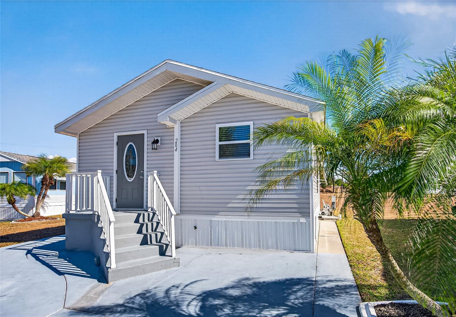 Welcome to easy Florida living at 204 Crown Point in Nokomis! Located in a gated, amenity-rich community where the lifestyle truly shines. Bring your boat, RV, fishing pole, and flip-flops. Whether you’re escaping the cold or planning to enjoy Florida year-round, this is the perfect place to call home. You’ll own your own land with low HOA fees, a rare and valuable bonus.
This 2-bedroom, 1.5-bath home features a 1989 mobile frame that was completely re-imagined, reconfigured, and rebuilt in 2023, you would think it was built new. Enjoy cathedral ceilings, an open floor plan, and a light, bright interior that feels modern and welcoming. Partially furnished for convenience and move-in ease. Don't miss out, now is the time.