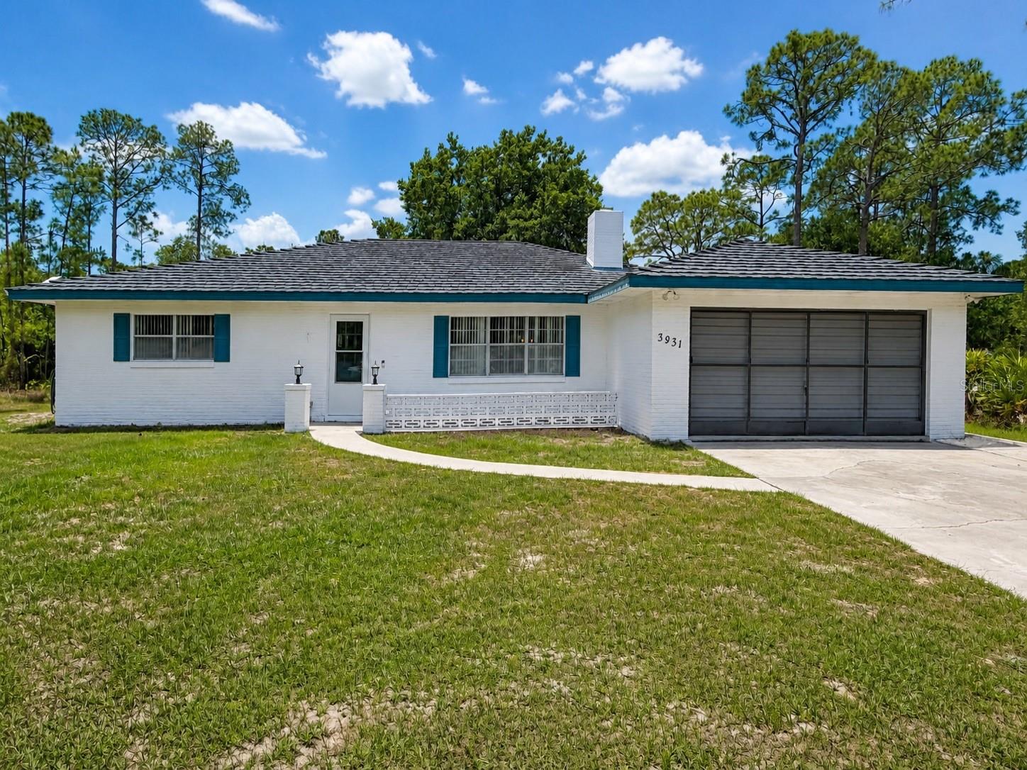 One or more photo(s) has been virtually staged. Welcome to 3931 Gaillardia in Indian Lake Estates. An updated 3 bedroom, 2 bathroom home offering comfort, space, and the relaxed Florida lifestyle. Situated on a generous 0.5-acre lot, this property provides plenty of room to spread out while enjoying the peaceful surroundings.

Inside, you’ll find an updated interior with a functional layout designed for everyday living and entertaining. The spacious living areas flow into a bright Florida room, creating the perfect spot to enjoy morning coffee, host guests, or relax year-round with views of the backyard.

The split 3-bedroom, 2-bath layout offers flexibility for families, guests, or a home office setup. Outside, the oversized lot provides space for gardening, outdoor activities, additional storage, or simply enjoying the extra privacy.

Located in the established community of Indian Lake Estates, this home combines updated living with the space and tranquility.