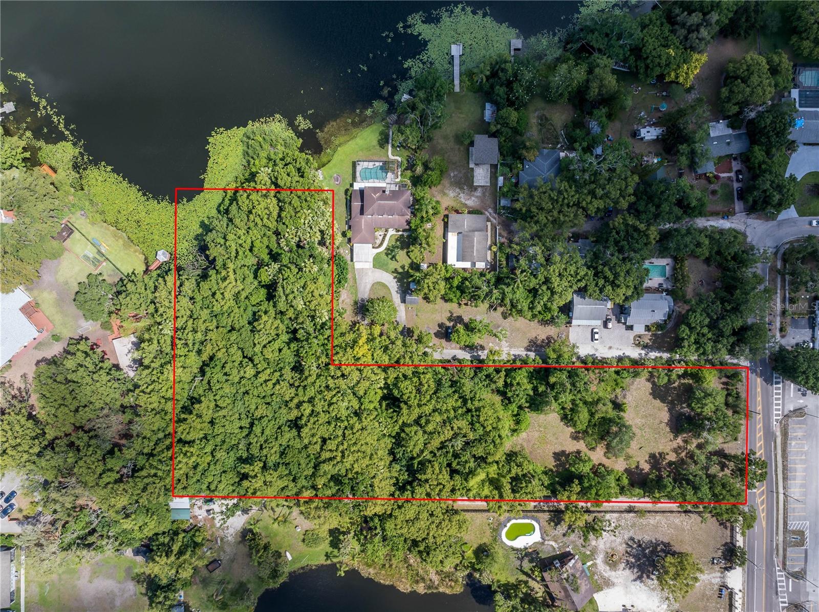 Rare opportunity to own a large lakefront property in Tampa's Carrollwood area. Enjoy the tranquility and wildlife this property has to offer, in the heart of the city. You can't get any better than that! This "L" shaped lot fronts the larger Twin Lake
and is accessed via N. Habana Avenue N off W. Waters Avenue. This lot also features a creek that runs through the property. The
property is currently zoned RSC-6 and is mostly buildable flood zone X besides the shoreline. This lot offers a vast array of possible uses with approval from City.