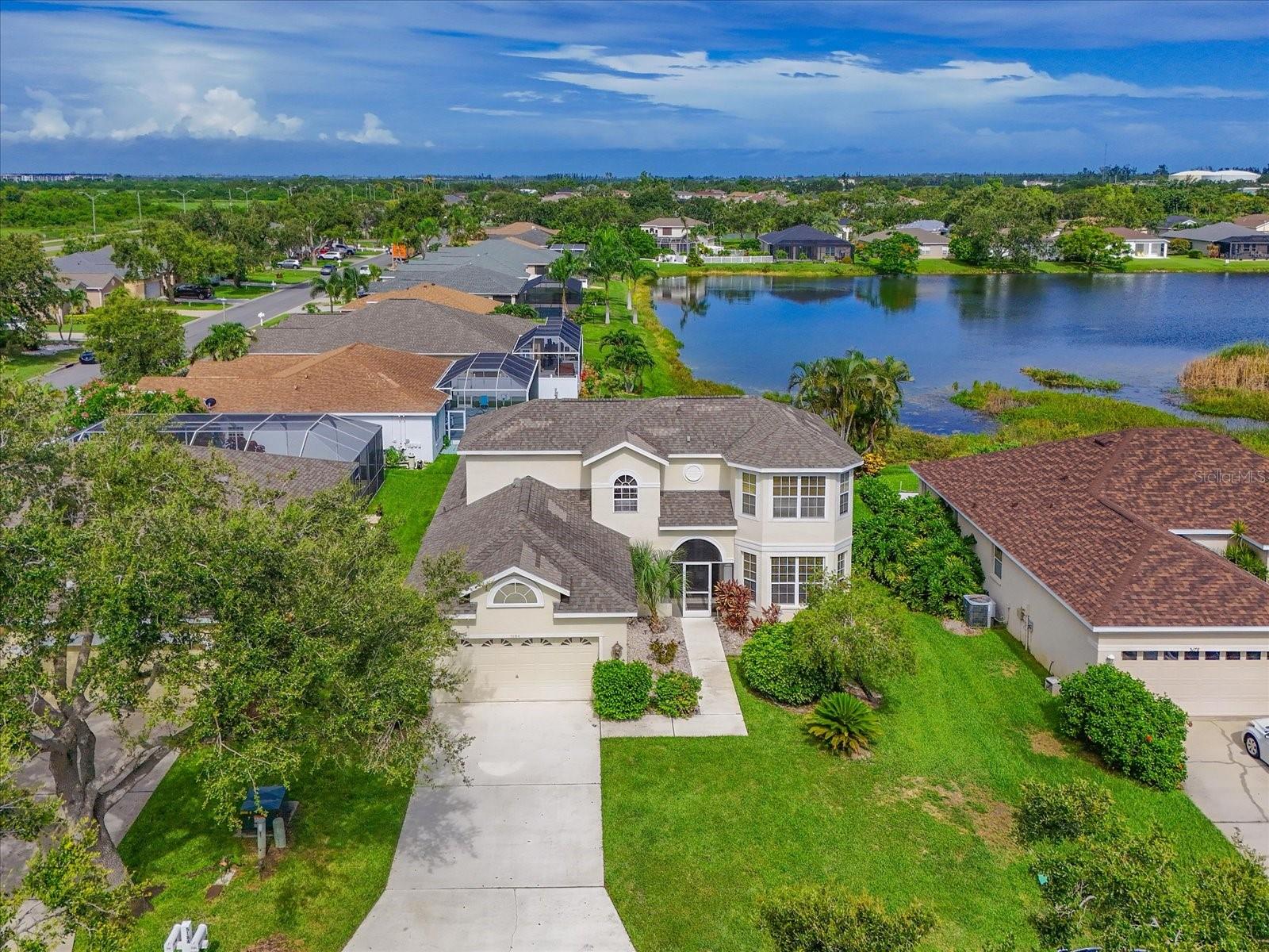HUGE PRICE REDUCTION!  GREAT INVESTMENT OPPORTUNITY IN SOUGHT AFTER COMMUNITY NEAR IMG ACADEMIES.   Large ,  solid built single family home has recently updated flooring, paint and lighting and is available immediately. Just minutes from the entrance of world renown IMG Academy, this home is located in the desirable Glenn Lakes community and is great for full time living or investment rental with bedrooms on both levels.
Solidly built block and stucco construction home with lake view offers 3 bedrooms plus den plus bonus room. 
Enter this home thru private screened entry area into a light filled great room with cathedral ceiling and sliding glass doors offering a light and bright first floor.  Step out into the large screened in lanai with a sparking pool (2017 and heated) and views to the lake. Watch the egrets and ducks while relaxing outside or entertaining friends and family. 
The efficient kitchen/dining area offers room to have a family dinner and has stainless steel appliances.
 The primary suite on the first floor boasts a large walk-closet, ensuite bath with separate shower and tub and dual vanities and can be a lock-out unit.
Bedrooms 2 and 3 are on the second floor and share an additional bath with tub/shower combination.  The loft/den space holds built in shelving for all your necessities or you can easily add a closet to convert this to a 4th bedroom. 
This home offers a 2 car garage and driveway that can fit additional vehicles. 
The beautiful beaches of Anna Maria, Bradenton, and Longboat Key are a short drive away.  Sarasota International Airport is 15 minutes away, and Tampa International Airport is less than 1 hour.
Enjoy local and fine dining in the Bradenton area or venture just 10 miles to downtown Sarasota with many dining, entertainment venues and shopping options.
Glenn Lakes is a deed restricted community with community tennis/pickle ball courts. Community is within walking and biking distance to IMG Academies.