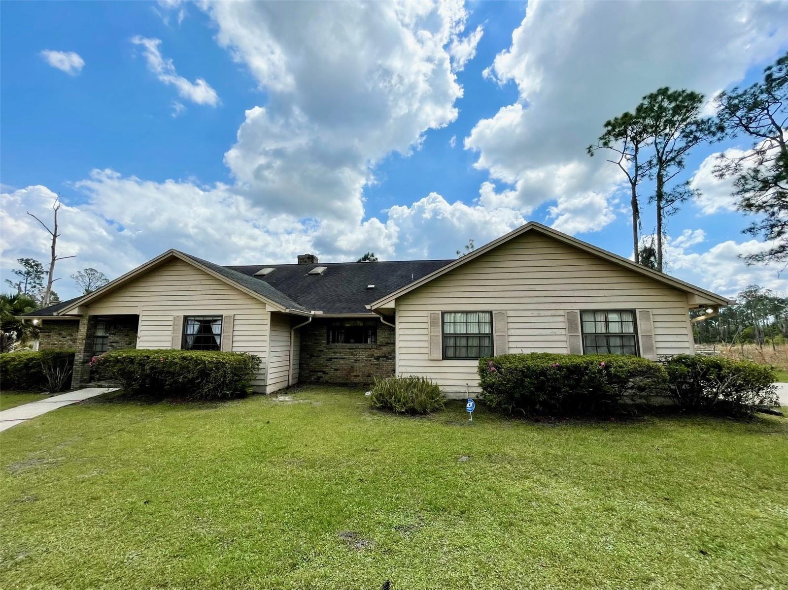 Tucked away on a private driveway in the desirable Seminole Woods Community, this wonderful 4-bedroom, 2-bath home offers peaceful living on 5 scenic acres.  Enjoy your own private retreat featuring a pool overlooking a tranquil pond, perfect for relaxing or entertaining. With plenty of space inside and out, this property combines comfort, privacy, and natural beauty.