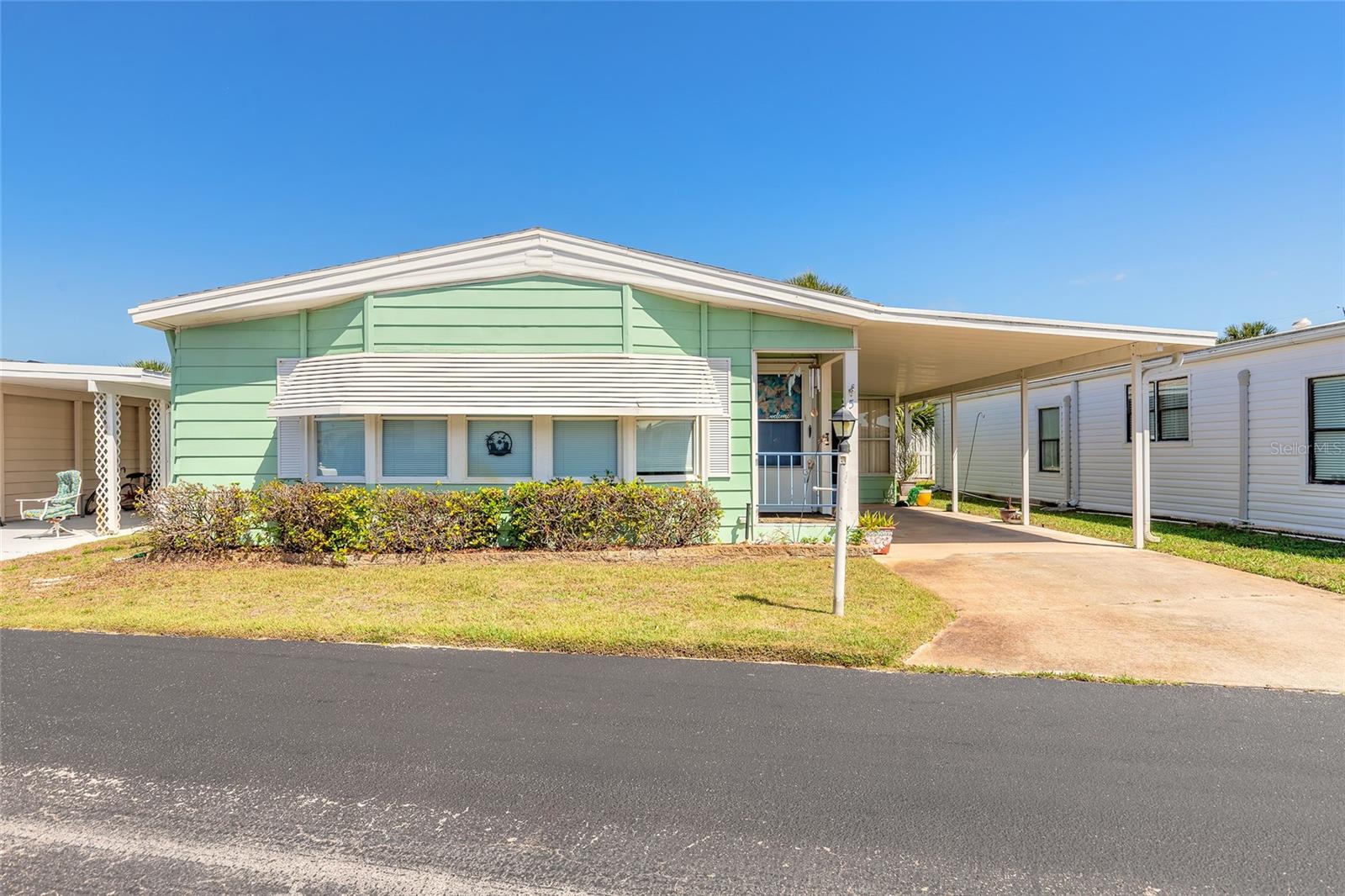 Welcome to this desirable and highly sought-after 55+ community, ideally located just steps from the Intracoastal Waterway and only moments from the Atlantic Ocean. Offered fully furnished—just bring your toothbrush and start enjoying the coastal lifestyle right away! Conveniently situated off A1A, just north of Flagler Beach’s popular restaurants, shops, and local attractions, this location offers the perfect balance of coastal living and everyday convenience. This well-maintained residence features an open-concept floor plan with durable vinyl flooring throughout the living and dining areas, along with tile flooring in the kitchen. The kitchen seamlessly opens to the main living space, making it ideal for entertaining. The bedrooms are generously sized, offering both comfort and functionality. Residents enjoy a wide array of amenities designed for an active and social lifestyle, including a heated swimming pool, two fishing piers, and a waterfront park perfect for relaxing walks. The fully accessible three-story clubhouse serves as the heart of the community, featuring an exercise room, library, billiards area, party room with kitchen, large-screen TV, and dance floor. The rooftop lounge offers stunning panoramic views of the ocean and Intracoastal, creating the perfect setting for gatherings or unwinding at sunset. This pet-friendly community also welcomes your furry companions. Don’t miss your opportunity to experience the best of coastal living in this vibrant and amenity-rich community! All information deemed accurate but cannot be guaranteed. Roof 2019. Brand new 3 ton AC.