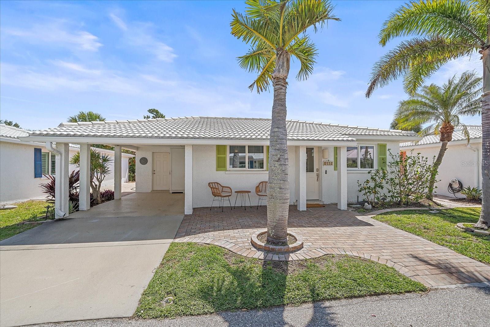Experience the best of Longboat Key in this beautifully appointed coastal retreat, nestled within the highly sought-after 55+ community of Spanish Main Yacht Club! This newly remodeled 2-bedroom, 2-bathroom residence is offered fully furnished turnkey with all brand-new, high-end coastal furnishings. Ideally situated just steps from the active marina and a picturesque seawall—perfect for peaceful mornings, frequent dolphin and manatee sightings, and stunning bayfront sunrises—you'll also enjoy Gulf-side beach sunsets just a short stroll away.

Thoughtfully designed, the home offers premium mattresses dressed in organic cotton linens and a fully stocked kitchen, providing a refined, move-in ready living experience from the moment you arrive. Residents enjoy access to a fantastic array of community amenities, including a private marina with available boat docks and kayak storage, deeded beach access, a heated community pool, and shuffleboard courts. Ideally located just minutes from the upscale dining and boutiques of St. Armands Circle and a scenic drive to Anna Maria Island, this property offers the perfect blend of active-adult tranquility and local accessibility. Whether you are boating, fishing, or relaxing in the bright, inviting Florida room, this is a rare opportunity to live the ultimate Longboat Key lifestyle.