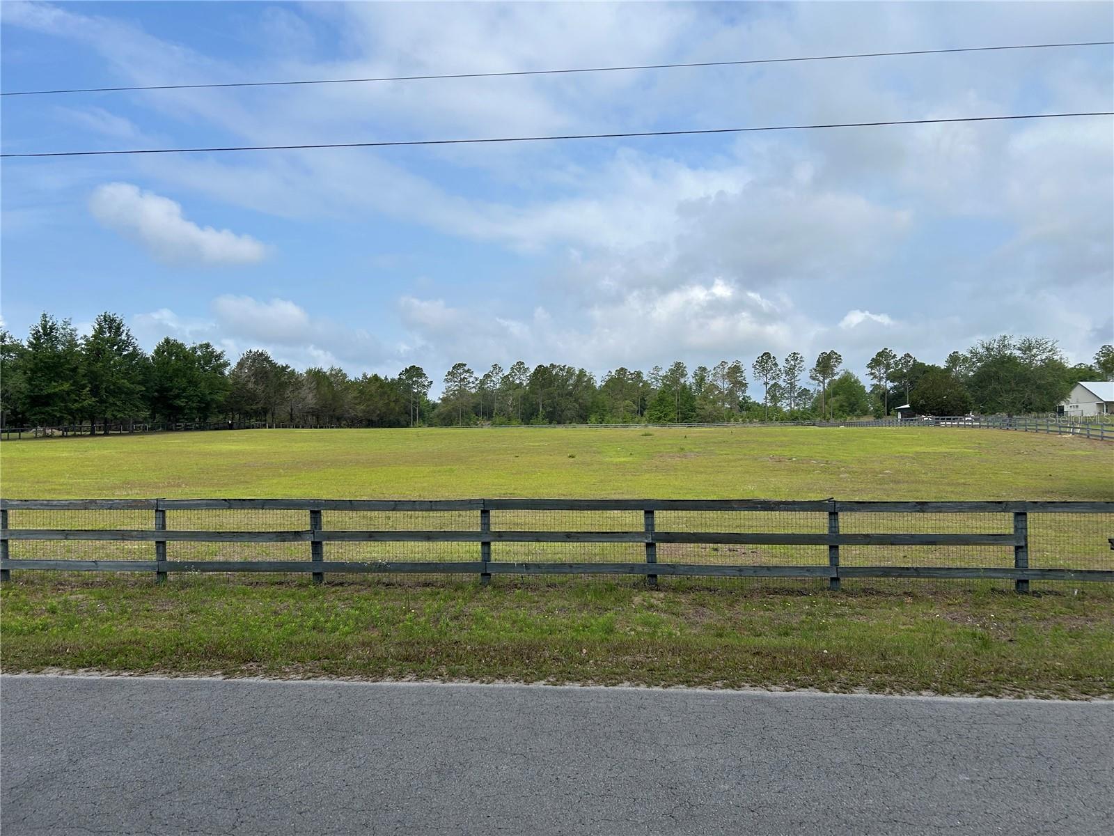BUILD YOUR DREAM HOMESTEAD ON ALMOST 5 BEAUTIFUL ACRES!
Looking for space, freedom, and flexibility? This 4.97-acre parcel on a paved road offers the ideal setting for your Florida country lifestyle. The property is already fenced with no-climb wire and three-board fencing, making it perfect for horses, livestock, hobby farming, or a private rural retreat. A healthy stand of grass is established, saving time and expense as you prepare to build.
With NO HOA and NO deed restrictions, you have the freedom to create the property you’ve been envisioning. Site-built and manufactured homes are allowed, offering flexibility whether you're planning a custom home, mini farm, equestrian property, or peaceful getaway.
Enjoy the charm of quiet country living with the convenience of paved road access, making daily travel easy while still providing privacy and space to spread out. Opportunities like this are becoming harder to find — nearly 5 acres of usable, fenced land ready for your plans.
