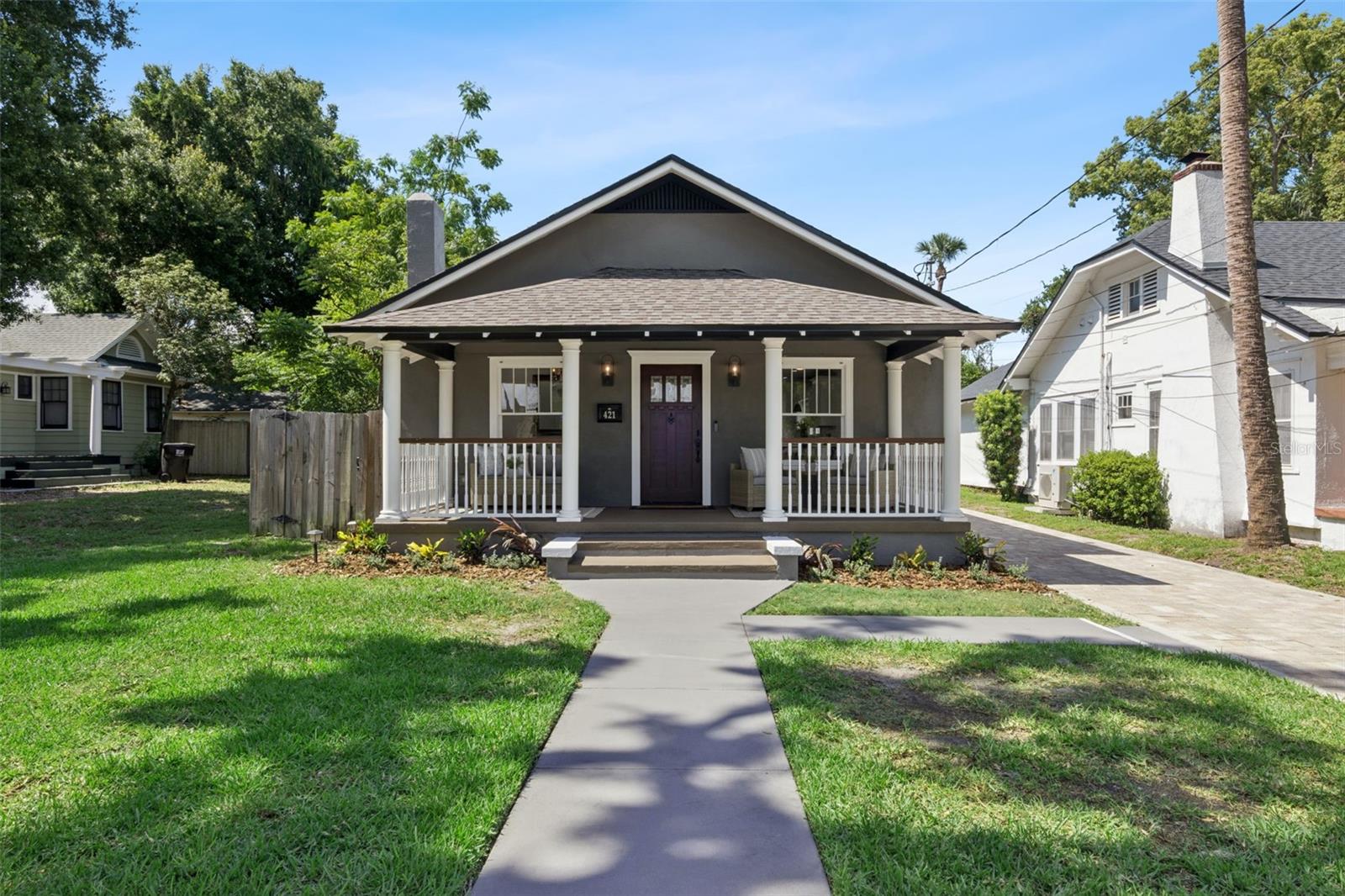 From the moment you step through the front door, you'll know you've found something special! Offering nearly 2,200 square feet of thoughtfully designed living space, this light-filled 4-bedroom, 2-bathroom pool home combines modern updates, generous living areas, and a spectacular backyard retreat that feels like your own private resort.
Expanded in 2012, the home more than doubled in size from the original structure, creating the spacious and functional layout you'll enjoy today. In 2021, the front porch was completely rebuilt and reinforced, with the ceiling height raised to the peak of the roofline, while a paver driveway was added to provide ample parking.
A welcoming front porch leads into a beautifully maintained interior featuring luxury vinyl flooring throughout. Just inside, the formal living area showcases custom built-in cabinetry surrounding a decorative fireplace, accented by a stunning Swarovski crystal chandelier.
The dining room flows seamlessly into the recently renovated kitchen. Designed with both style and function in mind, the kitchen features quartz countertops, a custom tile backsplash, 42-inch solid wood cabinetry with crown molding, stainless steel appliances, a built-in wine refrigerator, gas range, pendant lighting, and a large waterfall-edge breakfast bar that serves as the heart of the home.
Perfect for entertaining, the kitchen opens to an expansive gathering room with a dramatic tray ceiling and French doors that lead to the backyard oasis. Outside, you'll find a fully fenced and private retreat featuring a sparkling pool, custom deck, stone paver patio, summer kitchen, and multiple spaces for outdoor dining and relaxation.
Privately situated at the rear of the home, the spacious owner's suite offers a tray ceiling, sitting area, large walk-in closet with custom organization system, and a luxurious, spa-inspired ensuite bath, complete with dual sink vanity with anti-fog LED mirror, a soaking tub and a stunning glass-enclosed custom shower. Both the The split-bedroom floor plan provides privacy for family and guests, with three additional bedrooms located on the opposite side of the home.
Additional features include an indoor laundry room with utility sink, abundant storage throughout, deep bedroom closets, a 10' x 10' storage shed, custom window treatments, and custom plexiglass storm shutters that protect the home's historic windows.
Major updates provide peace of mind, including a brand-new roof (2026), HVAC system (2021), tankless gas water heater (2019), complete electrical and plumbing updates (2012), and exterior stucco and paint completed in 2021.
Beyond the home itself, you'll fall in love with the lifestyle that comes with living in Lake Eola Heights. Start your morning with a short stroll to Eola General, a favorite neighborhood gathering spot, for coffee, happy hour or a great meal. Enjoy community events and meet your neighbors at the Community Garden, participate in neighborhood happy hours, or take an evening walk beneath the tree-lined streets that make this historic district so beloved.
Just steps from Lake Eola Park and Thornton Park, you'll enjoy easy access to some of Orlando's best restaurants, shops, farmers markets, festivals, and more. Plus you're just minutes from the Dr. Phillips Center for the Performing Arts, the Kia Center, Inter&Co Stadium, and all major roadways.
Schedule your private showing today! You won't be disappointed!