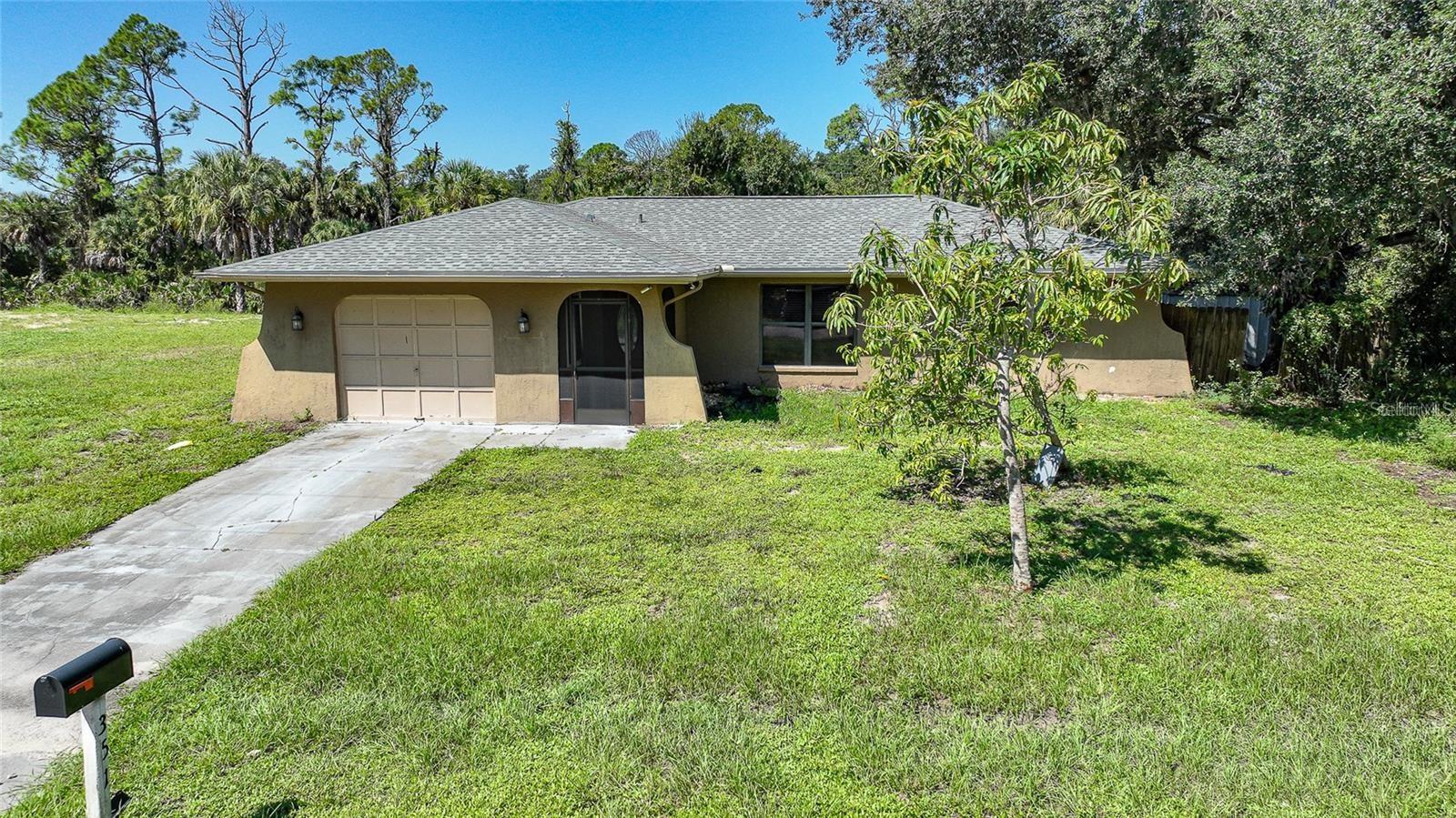 Rare double lot waterfront property offering approximately half an acre on a peaceful freshwater canal with beautiful backyard water views. This move in ready home has been extensively updated with new appliances renovated kitchen, updated bathrooms, new septic tank and drainfield, and newer well pump. The oversized property provides plenty of room for gardening, fruit trees, flowers, outdoor entertaining, RVs, boats, or future expansion. Ideal for buyers seeking a private garden retreat where they can enjoy growing tropical fruits and flowers while overlooking the serene freshwater canal. No HOA, no CDD fees, and located outside of a flood zone for added peace of mind. Convenient location with easy access to shopping, dining, schools, golf courses, parks, and Gulf beaches.