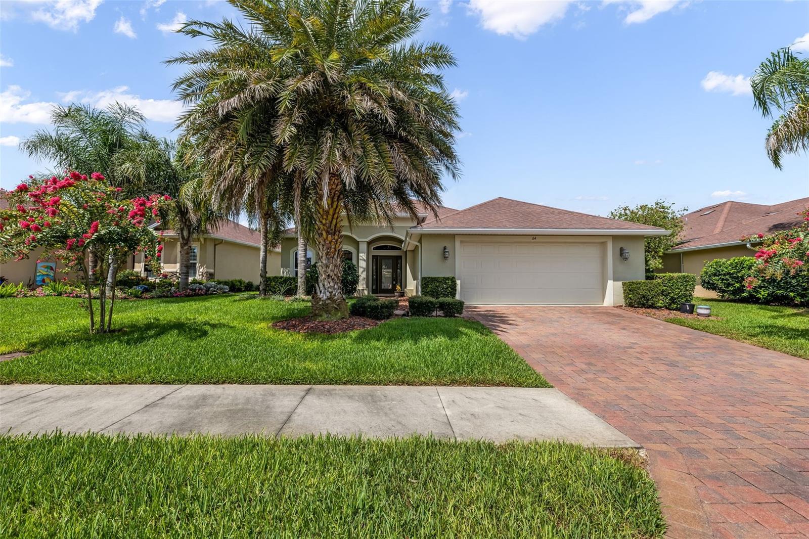 Welcome to 64 Arena Lake Drive, a beautifully maintained 3-bedroom, 2-bathroom concrete block home built by renowned Paytas Homes in 2017. Located in the highly sought-after Hidden Lakes community of Palm Coast, this home offers the perfect combination of quality construction, modern upgrades, and an unbeatable location.
Meticulously cared for and in like-new condition, this home features numerous upgrades throughout, including custom window treatments, upgraded light fixtures, ceiling fans, and thoughtfully designed garage storage that maximizes functionality. Step outside to your private backyard oasis featuring a custom covered patio with an extended paver deck overlooking a peaceful lake—an ideal setting for morning coffee, evening sunsets, or entertaining family and friends.
Hidden Lakes is one of Palm Coast's most desirable neighborhoods, known for its beautifully maintained homes, scenic lakes, and convenient location close to shopping, dining, medical facilities, golf courses, and just a short drive to Flagler Beach.
If you've been searching for a move-in-ready home with quality craftsmanship, tasteful upgrades, and serene waterfront views, this is an opportunity you won't want to miss. Homes in Hidden Lakes are in high demand, and this one is expected to sell quickly. Schedule your private showing today before it's gone!