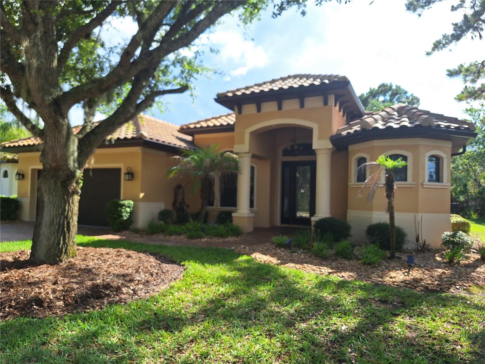 BETTER THAN NEW! MOVE IN READY, AFFORDABLE & where you always wanted to be--PALM COAST PLANTATION FOR SALE OR RENT!! or EVEN LEASE TO PURCHASE.  Many options to be in this awesome and affordable Palm Coast Plantation home.  Enjoy the Olympic community pool, fitness center, tennis courts, clubhouse, basketball and more.  Intracoastal access from the park next door and close to St Aug, Daytona, Ormond Beach, Jax, Orlando and more. This home has it all.  Custom Block home construction, Built by Saltwater Home with TILED ROOF, GUTTERS, TUSCAN GRANITE, TILED FLRS w/ the diamond cut, 8' LEADED GLASS FRONT DOOR, WAYNES COATING, CUSTOM WINDOWS, HURRICANE SHUTTERS,  5 CUSTOM UPGRADED CEILING FANS, TREYED AND COFFERED CEILINGS, NEWER APPLIANCES  W/ CUSTOM BACK SPLASH IN KITCHEN, CUSTOM GLASS PANTRY DOOR, PAVERED DRIVE & WALK & PATIO & FRONT PORCH, SCREENED & TILED LANAI, WROUGHT IRON FENCED OVERSIZED YARD OVER LOOKING THE LAKE, OVERSIZED 2 CAR GARAGE W/ NEW EPOXY FLR-PERSONAL DOOR & NEW IRRIGATIOIN PUMP W/ RID O RUST TANK TO KEEP STAINING OFF DRIVES WALK AND HOME.  Mature landscaping adds to the allure of this BETTER THAN NEW, PALM COAST PLANTATION HOME, WAITING FOR YOU!!  ALSO AVAILABLE FOR LEASE at $3K/M