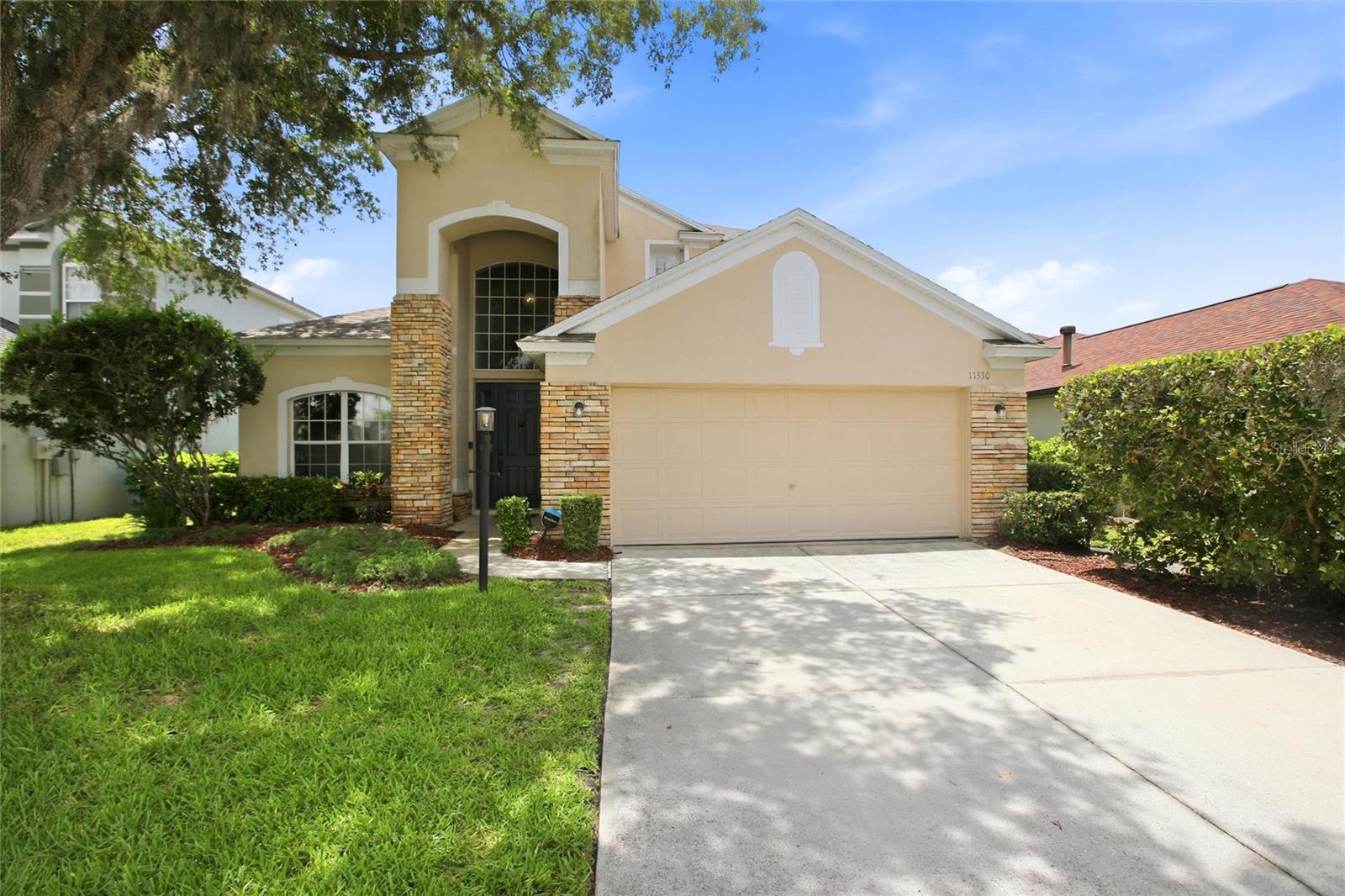 This home is ready for the next chapter in it’s story. Welcome to this spacious and thoughtfully updated residence situated on a premium homesite overlooking a peaceful retention pond and the added benefit of no immediate rear neighbors. Just your privacy, a view of the water and golf course beyond. From the moment you step inside, soaring ceilings and abundant natural light create an impressive first impression. The welcoming front living room provides a flexible formal sitting area, home library, or entertaining space while maintaining clear sightlines through the home’s open and functional layout. Continue through to the formal dining room, perfectly positioned for entertaining and holiday gatherings, before entering the expansive main living area where the family room, kitchen, and casual dining spaces seamlessly connect. The kitchen is designed for both everyday living and entertaining, featuring generous cabinet storage, ample counter space, an eat-in breakfast nook overlooking the backyard, and an additional breakfast bar for casual seating. 
The first-floor primary suite offers a private retreat with convenient access away from the secondary bedrooms and features a newly updated primary bathroom complete with an oversized tiled walk-in shower and modern glass enclosure. Also located on the first floor is a dedicated office or den space ideal for working from home, a convenient updated half bath for guests, and a functional mudroom/laundry area directly off the two-car garage. Upstairs, the flexible layout continues with an oversized loft-style entertainment area perfect for a media room, game room, play space, or additional living area. Two generously sized bedrooms and a full bathroom complete the second level, creating ideal separation for guests or family members. The home features a newer roof (approximately 3 years old) and solar attic fan providing additional circulation and cooling efficiency. The screened in lanai features a private in ground pool and plenty of patio room for entertaining. 
Outside, enjoy the privacy and tranquility of your premium homesite where water views, mature trees, and natural surroundings create a backyard setting that feels both private and connected to nature. Ideally located with convenient access to UTC, Lakewood Ranch Main Street, and Waterside, you'll enjoy some of the area's most popular shopping, dining, and entertainment destinations just minutes away. Nearby nature trails, parks, and championship golf courses provide endless opportunities to enjoy the Florida lifestyle.This home combines space, functionality, privacy, and flexibility in a layout designed for both everyday living and entertainment. Schedule today and make that next chapter yours tomorrow!