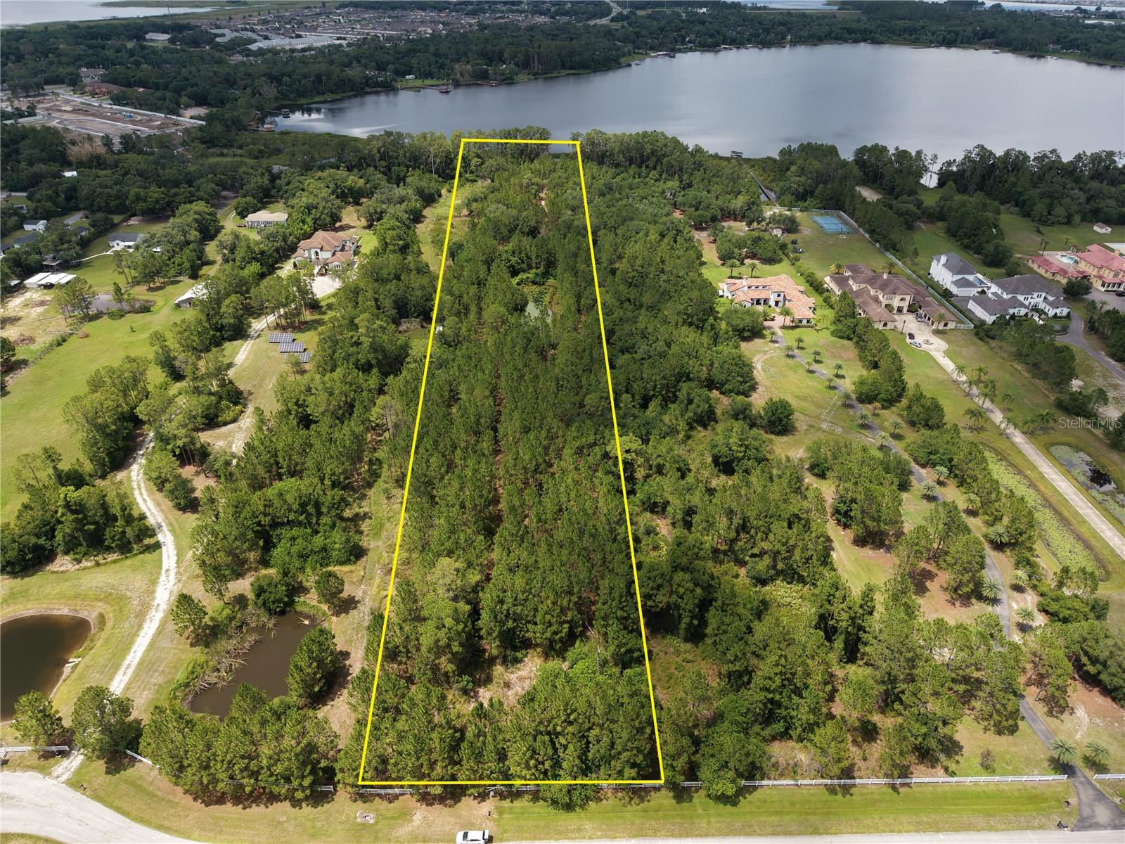 Rare 6-acre homesite located within the gated Lake Hendon community in St. Cloud, offering a unique opportunity to build your custom estate in one of Central Florida's fastest-growing corridors. Surrounded by natural beauty, conservation areas, and luxury custom homes, this property combines privacy and space with convenient access to the region's premier employment and lifestyle centers.
Ideally positioned just minutes from the transformational growth of Sunbridge and the Lake Nona area, residents enjoy proximity to Medical City, USTA National Campus, Orlando International Airport, shopping, dining, and entertainment while maintaining the tranquility of country living.
Lake Hendon is a private gated community known for its oversized homesites, peaceful setting, and access to Lake Hendon, a spring-fed lake popular for fishing, boating, and outdoor recreation. With six acres of land, there is ample room for a custom residence, guest house, detached garage, workshop, RV storage, or equestrian amenities, subject to community guidelines.
Whether you are seeking a private family compound, an executive estate, or a long-term investment in the path of growth between Lake Nona and Sunbridge, this exceptional property offers unlimited potential.