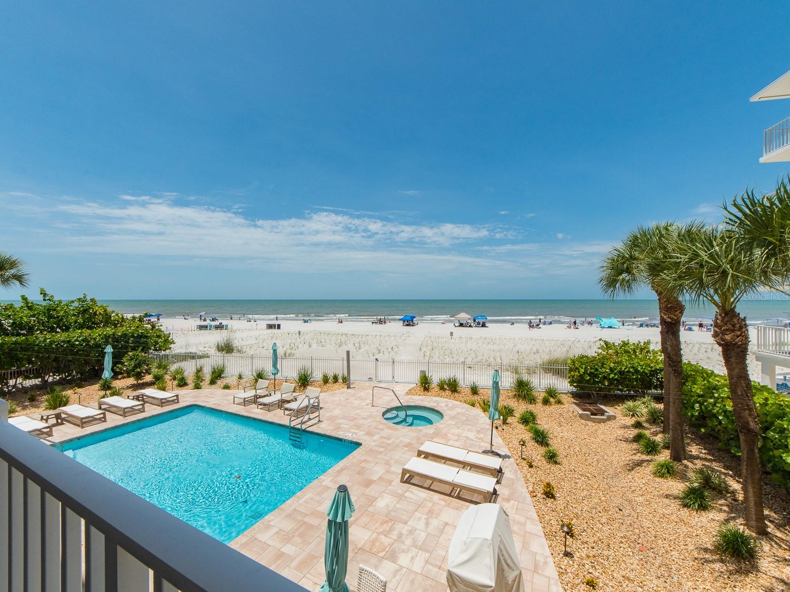 Seaside splendor at Seacrest! The best in coastal living in this stunning three bedroom, three bath waterfront residence, located on the second floor for a straight on Gulf view. Over 2,100 sq. ft and fully remodeled in 2020, this home offers elevated finishes and modern luxuries at every turn. The chef-inspired kitchen boasts all stainless-steel appliances, under-cupboard lighting, custom soft-close cabinetry with pull-out shelving, granite countertops, and a social island in addition to a generous breakfast bar. The floor plan is enhanced by porcelain tile flooring throughout, delivering a sophisticated wood-look design that is both elegant and durable—perfect for seaside living. The primary bedroom suite is an oasis offering fantastic Gulf views and a spa level ensuite bath featuring a soaking tub, an oversized glass-enclosed walk-in shower, Toto commode, and a generous walk-in closet. Two of the bedrooms feature an ensuite bath and the 3rd bedroom includes a jack and Jill bath and a Murphy Bed with a built in Fold Down Desk. Large private balcony, equipped with storm shutters overlooking the heated swimming pool and spa and updated landscaping. Other recent improvements include all new PGT windows (2025), new HVAC (2025) and new Toto commodes with Bidet Feature and Heated seats! Seacrest is a boutique building of just 8 residences nestled on the beaches of Indian Shores, ideal for full-time living, or a second home at the beach. Thirty-day minimum rental policy and pet friendly, this is a great opportunity to own a highly desirable beachfront property that offers everything Florida.