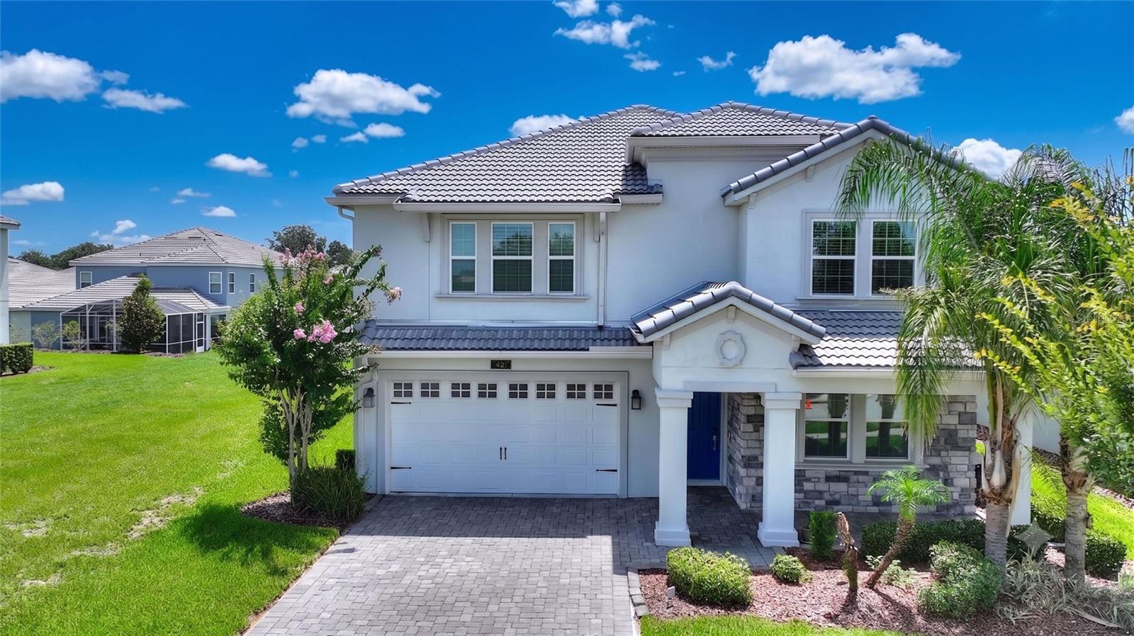 Welcome to this spacious Nicholas model located in the highly sought-after ChampionsGate Country Club, offering 5 bedrooms, 4.5 bathrooms, and 3,809 square feet of thoughtfully designed living space. This versatile floor plan is ideal for multi-generational living, large families, or those who love hosting family and friends.

The home features two private primary suites—one conveniently located on the main floor and another upstairs—along with a junior suite, two additional bedrooms, and another full bathroom on the second level, providing plenty of space and privacy for everyone.

Designed with convenience in mind, you'll enjoy two laundry areas: a main-floor laundry closet with a stackable washer and dryer, and a full upstairs laundry room. The spacious downstairs family room is complemented by an oversized upstairs bonus room that can easily serve as a media room, game room, playroom, second family room, fitness area, or whatever best suits your lifestyle. The loft has also been thoughtfully reconfigured to create a private home office, perfect for working remotely or studying.

This home has been extensively updated, including a new roof installed in 2025, a fully paved screened-in lanai that creates the perfect outdoor living space, gutters, a whole-house water treatment system, and numerous interior upgrades. The upstairs primary suite features elegant marble flooring, while the bathrooms have been beautifully renovated with upgraded tiled walk-in showers, replacing the original tubs for a more luxurious, spa-like feel.

Living in ChampionsGate Country Club means enjoying one of Central Florida's premier resort-style communities. Your HOA includes a full golf membership, access to five exceptional amenity centers, including the homeowners-only Plaza Amenity Center, the homeowners-only North Pool, the Oasis Club, the Retreat Club, and the ChampionsGate Golf Club. Residents also enjoy 24-hour manned, gated security, multiple resort-style pools, fitness centers, tennis and pickleball courts, volleyball courts, restaurants, social activities, and so much more.

This exceptional home offers the perfect combination of space, functionality, and an unmatched country club lifestyle. Schedule your private showing today and discover everything ChampionsGate Country Club has to offer!