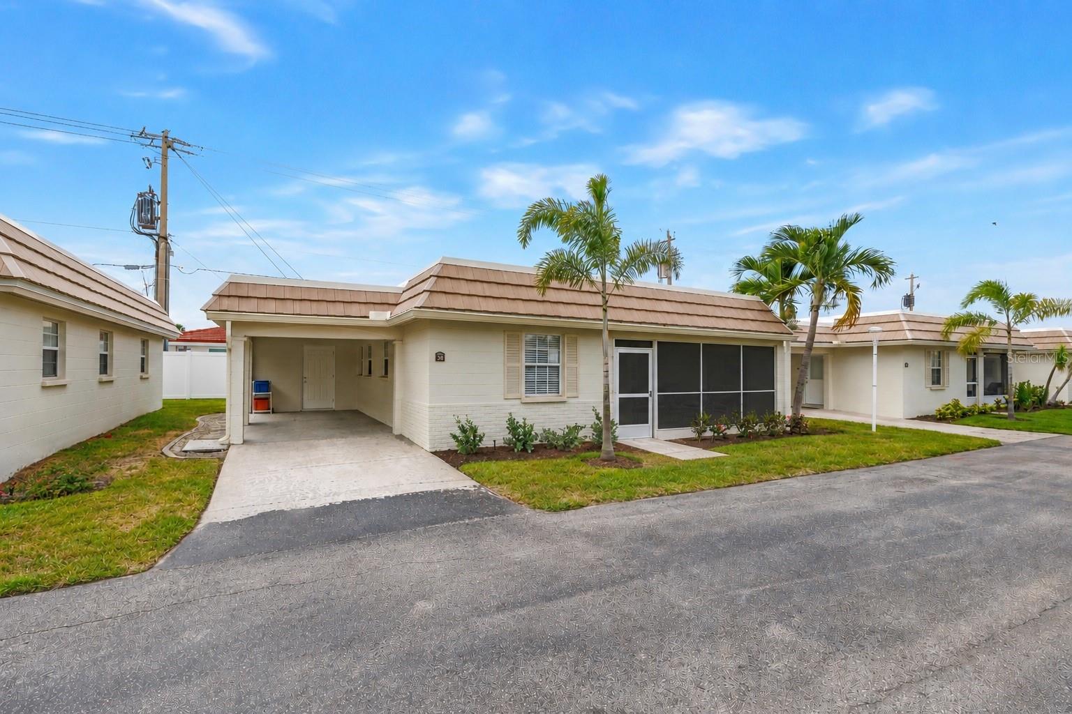 Step into your slice of paradise with this amazing lifestyle opportunity in Siesta Key's esteemed Island House Beach Resort. This impeccable  2-bedroom, 2-bath luxurious coastal Villa, which was completely renovated in 2025, seamlessly blends comfort, style, and investment potential, making it the perfect choice for discerning buyers, seasonal residents, and savvy investors alike. From the moment you enter, you'll be welcomed by a bright, open-concept living area with hurricane-impact windows and sliding glass doors that fill the space with natural light and peace of mind. The dedicated dining enclave flows into a chef-inspired kitchen, fully equipped with gleaming, state-of-the-art stainless steel appliances, ideal for preparing both gourmet meals and casual snacks after a day at the beach. Unwind in your private enclosed lanai, where gentle Gulf breezes create a serene backdrop for evening cocktails, before retiring to the villa’s two spacious bedrooms. But the real draw is that, just steps from your door, the Gulf of Mexico’s crystal-clear waters and powdery white sand are mere moments away. Whether you decide to spend the day lounging in private beach cabanas or indulging in the Island House’s other resort-style amenities, like year-round swimming in the nearby heated pool, preparing the day's fresh catch on the outdoor grills, or challenging friends in the game room or on the beachfront shuffleboard courtyard, every day feels like a vacation. Beyond the complex, endless adventure awaits. Tee off at nearby golf courses, comb one of the many nearby beaches for shells and shark teeth, go hiking or birding in one of the areas fabulous preserves and state parks, or get out on the water boating, fishing, kayaking, or flying high on a parasailing excursion; Then take the afternoon to explore vibrant local shops, acclaimed restaurants, and the charming art galleries of Siesta Key Village, Gulf Gate, and downtown Sarasota. Whether you’re seeking a luxurious personal retreat or a high-demand managed vacation rental for your investment portfolio, this villa offers unparalleled value and an enviable coastal lifestyle. Opportunities like this are scarce, so schedule your private tour today and make your dream a reality! A 1% RATE BUY-DOWN IS AVAILABLE TO QUALIFIED BUYERS WHO WORK WITH THE SELLER'S PREFERRED LENDER.
