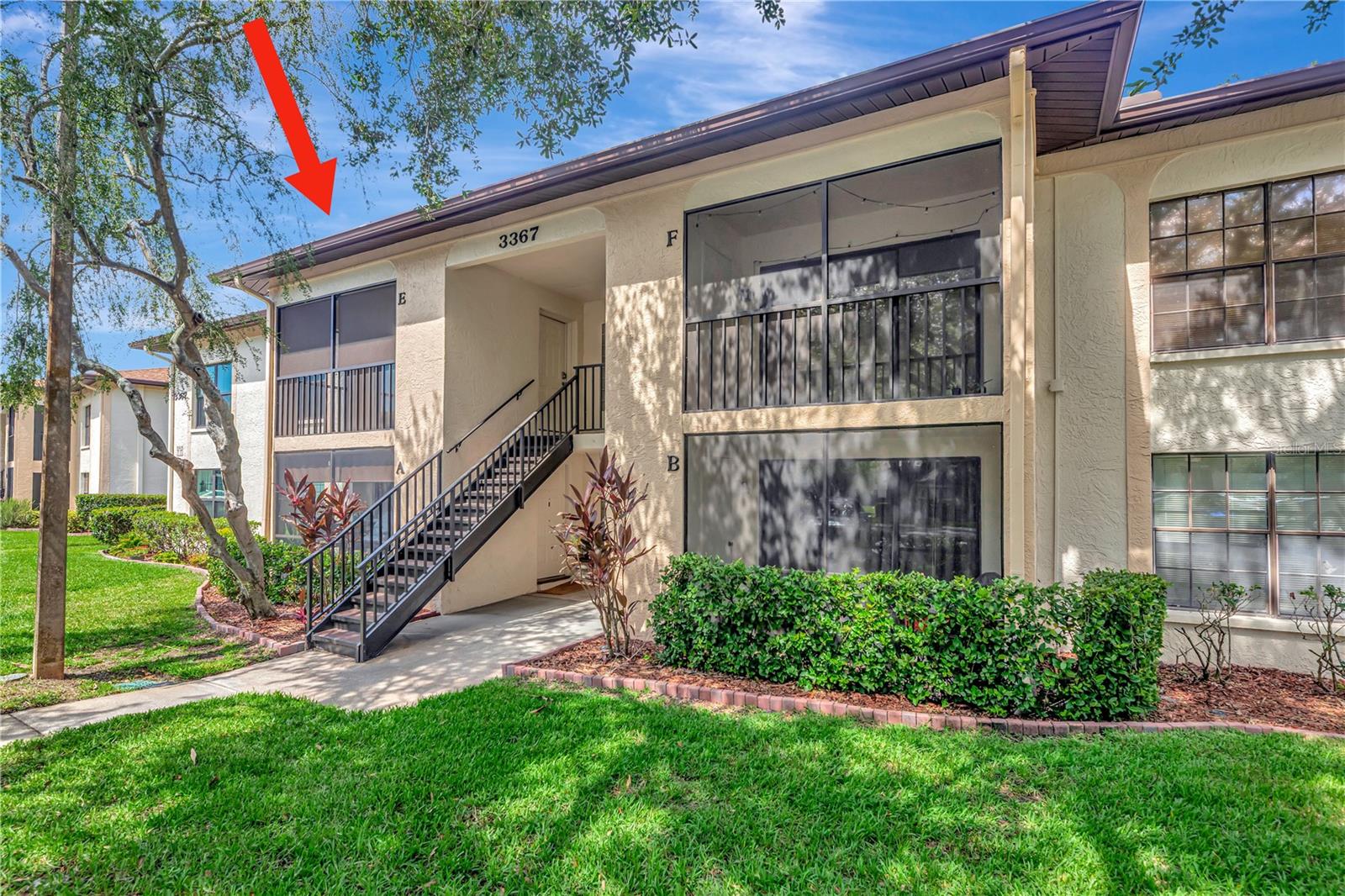 Welcome to Crystal Lake, one of Palm Harbor's most sought-after and well-maintained condominium communities. This beautifully updated 2-bedroom, 2-bath residence is sure to impress from the moment you step inside. Featuring vaulted ceilings, hurricane-impact windows and sliding glass doors throughout, seamless vinyl flooring in the main living areas and bedrooms, and fresh interior paint completed in 2023, this home offers both style and comfort. The open-concept floor plan is ideal for everyday living and entertaining. The kitchen features updated wood cabinetry, granite countertops, a tile backsplash, water filtration system, and matching Samsung stainless steel appliances. The spacious primary suite includes a walk-in closet and an updated en-suite bathroom with a walk-in tiled shower, tile flooring, and a wood vanity topped with a solid-surface countertop. The second bedroom offers a built-in closet and is conveniently located adjacent to the updated guest bathroom, which features a tiled tub/shower combination, tile flooring, and a wood vanity with a solid-surface countertop. Additional highlights include an interior walk-in laundry room with washer and dryer included, as well as a screened and tiled lanai with a private storage closet. Major updates include a water heater installed in 2017 and an HVAC system replaced in 2018. Crystal Lake is a financially stable community with strong reserves and no recent special assessments. The monthly condo fee of $347 includes water, sewer, trash, exterior maintenance, roof maintenance, painting, paving, landscaping, exterior insurance, and more. This all-ages community offers convenient access to a variety of recreational amenities, including the YMCA, Lansbrook Golf Club, scenic walking trails, and nearby nature preserves. Residents also enjoy close proximity to Lake Tarpon, shopping, dining, Tampa International Airport, and Florida's beautiful Gulf Coast beaches. Don't miss this opportunity—schedule your private showing today!