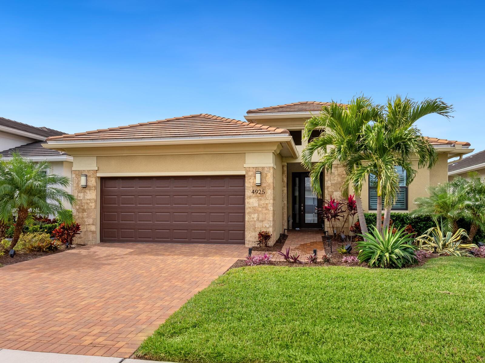 Long lake views. Sunset skies. One of the best lots in Cresswind. This 3-bedroom, 3-bath home with a den offers both comfort and peace of mind, built to current codes, not in a flood zone, with hurricane-impact windows and no storm damage in 2024. Inside, thoughtful upgrades elevate the space, including porcelain tile flooring, an expanded kitchen, tray ceilings, and an open, easy-flow layout designed for everyday living and entertaining. The screened lanai is where it all comes together, offering a peaceful place to unwind while taking in the shimmering lake and evening sunsets. Cresswind feels like an over-55 cruise ship on land, where there’s always something to do and someone to do it with, thanks to a full-time Lifestyle Director who keeps the calendar full of activities and events. Residents enjoy a SmartFit Training Center, Cardio Studio, Arts and Crafts Studio, multipurpose event rooms, a lounge, game room, and a variety of clubs and social spaces, along with 8 pickleball courts, 2 tennis courts, dog parks, a resort-style pool, resistance pool and spa, an event and food truck plaza, bocce courts, and more. Monthly fees include lawn maintenance, irrigation, cable, and internet, giving you more time to relax and enjoy the lifestyle.