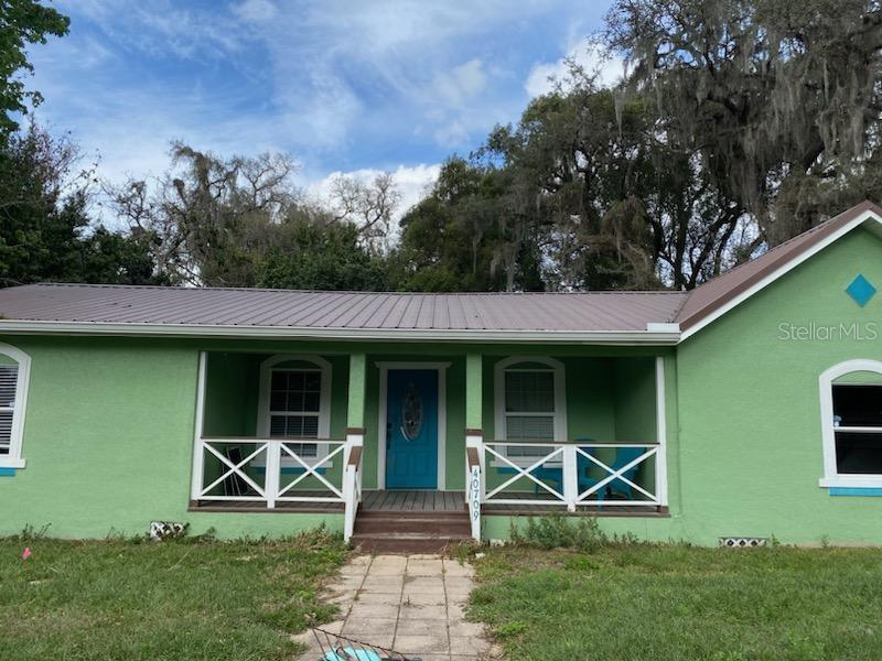Attention all homebuyers! Get ready to fall in love with this charming 3 bedroom, 2 bathroom home in the desirable Richland subdivision of Zephyrhills. This beautifully maintained property boasts hardwood floors in the main living space and carpet in the bedrooms, with laminate in the bonus room. The fully fenced yard provides you with privacy and peace of mind, while the metal roof (approximately 8 years old) and new well pump (installed in 2021) add to its durability and efficiency. With no HOA or CDD, you can enjoy the freedom of living on your own terms. Relax and unwind on the front porch, back patio, or under the pergola. The AC, water softener, appliances, deck, and pergola are all 3 years old or newer, ensuring your comfort and convenience. The property just needs some new carpet, paint, and landscaping to be perfect. With its own septic system, you won't have to worry about costly sewer bills. Don't miss out on this incredible opportunity to own a piece of Zephyrhills paradise. Contact us today to schedule a viewing and make this property your own!