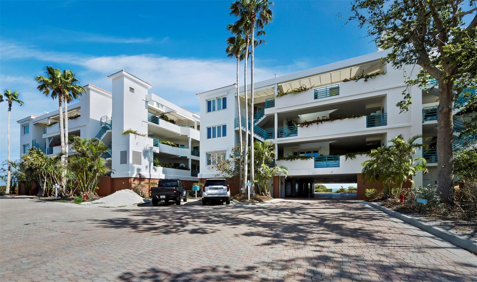 Perfectly positioned on Sarasota Bay at the southern end of Longboat Key, this beautifully renovated 3BR/3BA, 2,298± sq. ft. residence with a private 2-car garage at Tangerine Bay Club combines luxury, comfort, and a premier location just moments from St. Armands Circle and downtown Sarasota. A private front courtyard welcomes you inside, where rich wood floors, custom doors, and neutral tones complement the panoramic bay views. Redesigned from its original layout, the home offers an open flow through the main living areas. The reimagined chef’s kitchen features stone countertops, custom cabinetry, stainless-steel appliances, a wine fridge, and center island. The living room’s corner fireplace and full wall of glass highlight the sparkling water views. The spacious terrace is ideal for relaxing or entertaining. The primary suite offers terrace access and a beautifully updated bath with dual vanities, glass shower, and private water closet. Tangerine Bay residents enjoy a lagoon-style pool with waterfalls, spa, tennis and pickleball courts, day dock, fishing pier and membership to the Bay Isles Beach Club with private beach access, cabanas and more. Across from the Longboat Key Club, optional membership includes access to golf, tennis, beach and pool facilities, marina, spa, and fine dining.