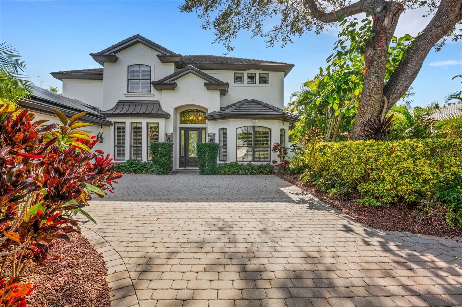 IF YOU ARE LOOKING FOR THE BEST WEST OF TRAIL PROPERTY WITHIN A 5 MINUTE WALK TO SOUTHSIDE VILLAGE, SARASOTA MEMORIAL HOPITAL, SOUTHSIDE ELEMENTARY AND 2 MILES TO DOWNTOWN, THEN THIS IS THE ONE! 3 CAR AIR CONDITIONED GARAGE, 4 bedroom/4 bath that is so LUSHLY LANDSCAPED. Super layout with The Primary suite on the first floor and a large Den/Office. The upstairs boasts an additional suite with an attached oversized bonus room. 2 other large bedrooms share a Jack and Jill bath. Sliders open up to a large pool deck with covered dining/seating area and outdoor kitchen. BIG PLUS... Solar Panels (transferable 25 year warranty) assist in powering of electric, hot water, pool heat. Whole house GENERATOR and a high end water filtration system are added features. This home is a MUST see! Within minutes to our beautiful Gulf beaches and Downtown Sarasota, this home is ready for it's new owner! COME TAKE A LOOK AT THIS AWESOME PROPERTY!