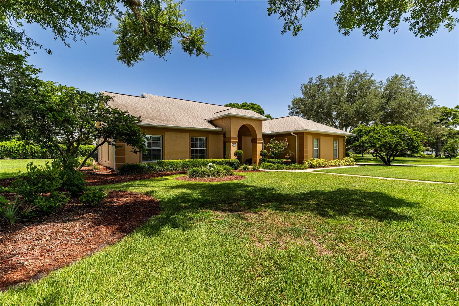 Effortless flow meets timeless elegance in this beautifully updated home, where lush, recently refreshed landscaping sets a warm, welcoming tone from the moment you arrive. This beauty features three bedrooms and two full bathrooms with 2,408 square feet, which is separate from the Florida room that offers approximately 200 square feet in addition to the 31' x 8' screened enclosure. Step inside to soaring ceilings, 12' stacking sliding doors, and oversized picturesque windows that blur the line between indoor and outdoor living — a home clearly designed with entertaining in mind. At the heart of it all is a true chef's kitchen, outfitted in 2023 with a Samsung French-door refrigerator featuring dual ice makers, double wall ovens with convection, a convection/air-fryer microwave, and an induction cooktop. Prep dinner or savor your morning coffee while taking in serene backyard views through the expansive framed windows. The living room flows seamlessly into an enclosed Florida Room overlooking the newly redesigned backyard enclave — the perfect space to relax or host guests year-round. The owner's suite offers a spacious retreat with a spa-like bath and two closets, including a generous walk-in. Striking new chandeliers add a touch of sophistication throughout, complementing the home's overall style and design. Practical updates abound, too: a hidden room tucked away for the HVAC and water heater doubles as extra storage, while major systems have been thoughtfully maintained — a full Trane HVAC system installed in 2019, a new roof in 2020, and professionally cleaned ductwork in 2024. Car and toy enthusiasts will love the large side-entry garage, complete with a recently added RV receptacle and extended parking pad, offering plenty of room for a motor home or other recreational vehicles. Best of all, there's no HOA to worry about, and the home sits on an almost .46-acre lot — offering extra space and privacy that's hard to find. The location can't be beat either, with close proximity to Silver Lake, Via Port Mall, and major highways, all while being centrally located for an easy commute. Set in a sought-after Golf Cart Community, this home checks every box. Schedule your private tour today and experience 34021 Park Lane Leesburg, FL for yourself! All information recorded in the MLS is intended to be accurate however, it should be independently verified by buyer and their agent. Check out the Virtual Tour!!