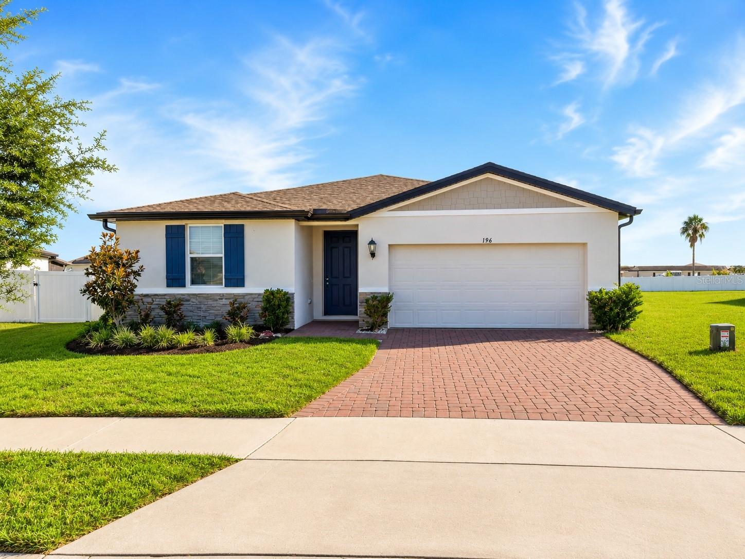 Better than new and built in 2022, this beautifully maintained 4-bedroom, 3-bathroom home offers 1,988 square feet of thoughtfully designed living space on an oversized lot in one of Haines City's growing communities.  Step inside to an open-concept floor plan featuring durable LVP flooring throughout the main living areas, creating a stylish, low-maintenance space ideal for both everyday living and entertaining. The well-appointed kitchen offers ample cabinetry, generous counter space, and a functional layout overlooking the spacious living and dining areas, making it the heart of the home.Designed with comfort and efficiency in mind, this home includes spray foam insulation, providing enhanced energy efficiency, improved indoor comfort, and potential savings on utility costs year-round. The split-bedroom layout offers privacy, with a spacious primary suite serving as a relaxing retreat complete with an en-suite bathroom and generous closet space. Three additional bedrooms and two full bathrooms provide plenty of room for family, guests, or a home office.  Outside, the oversized lot offers endless possibilities for outdoor living. Whether you envision adding a pool, creating your dream backyard oasis, or simply enjoying extra space for entertaining, this property provides the flexibility to make it your own.  Conveniently located near shopping, dining, schools, parks, golf courses, and major highways, this home also offers easy access to Orlando, Walt Disney World, and other Central Florida attractions. Combining modern construction, energy-efficient features, a spacious floor plan, and an exceptional lot, this move-in-ready home is a rare opportunity you won't want to miss. Schedule your private showing today!  No CDD fees!