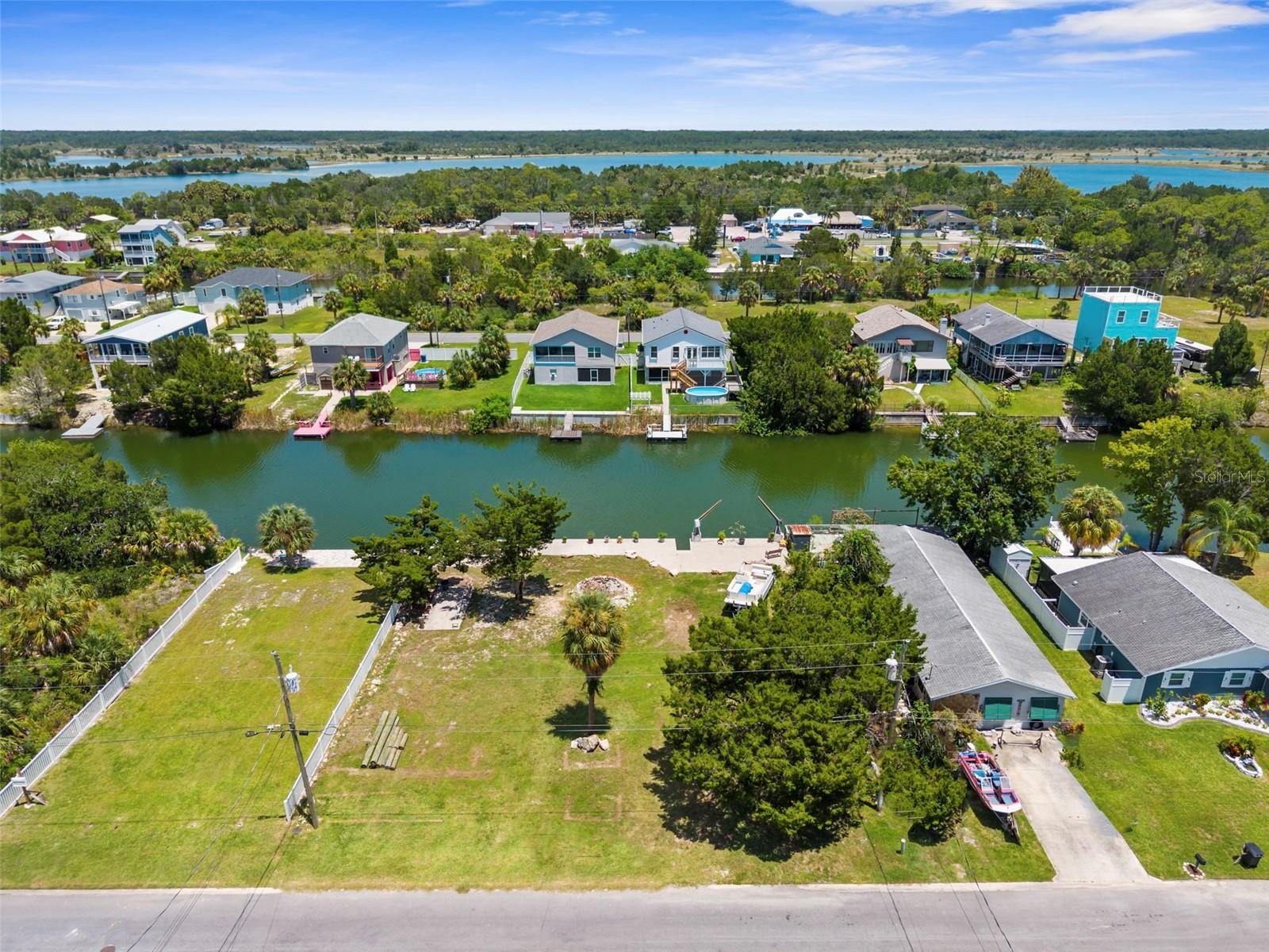 LARGE, DOUBLE LOT in the heart of Hernando Beach. These waterfront lots offer 100 FEET OF SEAWALL frontage, OVERSIZED SEAWALL CAP providing a wide waterfront walkway and usable outdoor space, TWO SETS of concrete steps, complete with DAVITS and combines for .23 acres, perfectly positioned and ready for someone to build their dream home, vacation getaway or investment property. With NO HOA, NO CDD and NO restrictions on short-term rentals, the possibilities here are as open as the water views.

Enjoy the laid-back charm of Hernando Beach, where you will find seafood markets, waterfront restaurants and marinas, while shopping, entertainment, hospitals, and additional dining options are all within close proximity, making this an ideal location for both full-time residents and weekenders. Outdoor lovers will appreciate being just minutes to the Weeki Wachee Preserve. Only 1 hour to Tampa International Airport and 2 hours to Orlando theme parks.  Don't miss this unique chance to own a true slice of Florida’s waterfront lifestyle!

Whether you're envisioning a peaceful retreat, an active waterfront lifestyle or a high performing rental, these lots are a rare opportunity to bring your vision to life in one of Florida’s most inviting Gulf Coast communities.