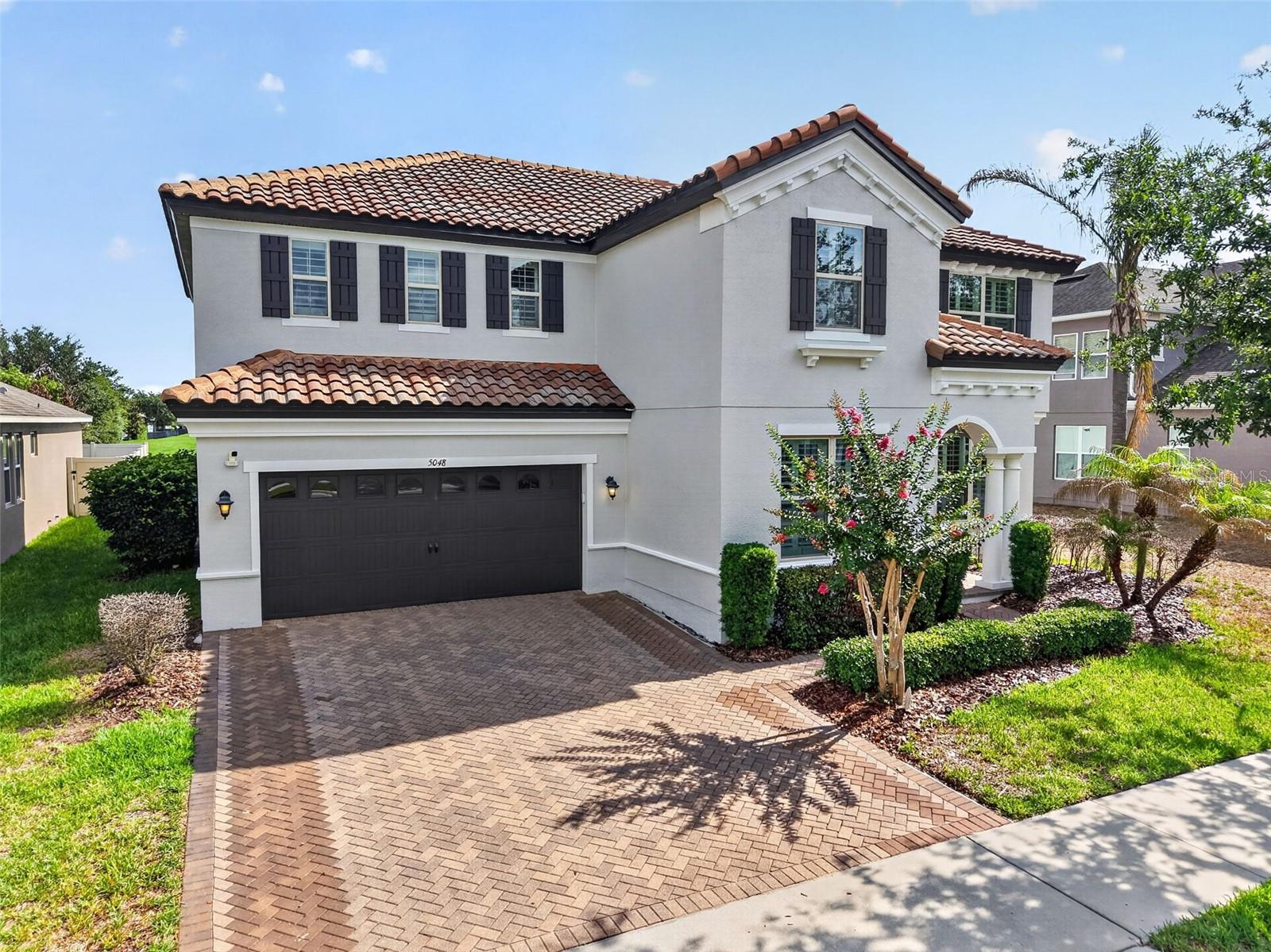 Located in the highly sought-after Orchard Hills community and served by top-rated A schools, this Beazer-built home offers nearly 5,000 square feet of thoughtfully designed living space. Features include a dedicated home office, expansive bonus room, media room, fitness space, and flexible living areas designed for the way families live today. An outdoor fireplace and entertaining area extend the living space beyond the walls of the home, while the tile roof and quality finishes add lasting value. Residents enjoy resort-style amenities including a community pool, fitness center and playground. This is the kind of home that adapts to the way families live today.