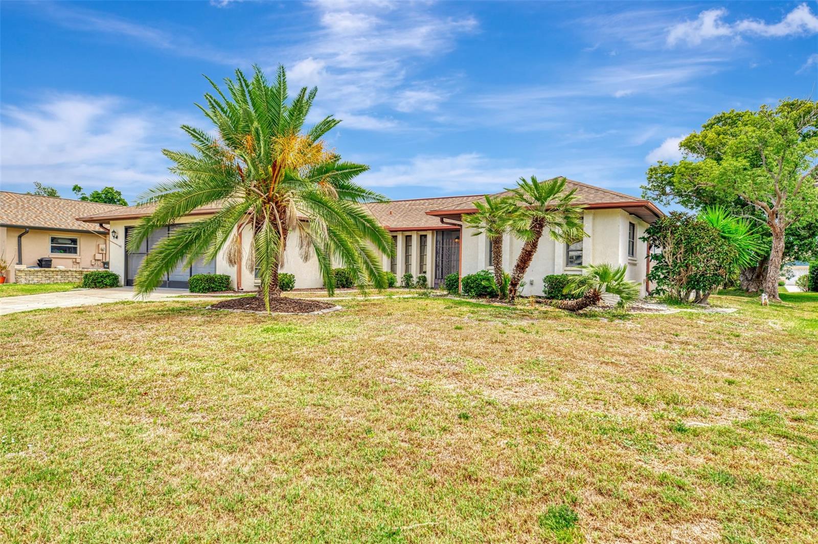 25K PRICE IMPROVEMENT!! Welcome to the highly sought-after community of Gulf View Estates, where low HOA fees and NO CDD fees make this beautifully maintained home an exceptional value. Ideally located between the stunning shores of Manasota Beach and Venice Island, you can enjoy the Florida coastal lifestyle without the high beachside price tag. Manasota Beach is less than five minutes away!! This charming home offers a spacious and functional split-bedroom floor plan featuring soaring ceilings, formal living and dining rooms, and a comfortable family room perfect for everyday living and entertaining. Sliding glass doors from the living room and kitchen dining area open to a covered lanai and screened HEATED COCKTAIL POOL/SPA, creating the perfect space to relax after a day at the beach.  Recent updates include re-piping, new hurricane shutters, front sliding screen for the garage, and more for added peace of mind. Ideally located (NOT IN A FLOOD ZONE!!) so you can enjoy unique local cuisine, HISTORIC DOWNTOWN VENICE, world class fishing, award winning beaches, shopping, golf, 2 spring training venues (Rays and Braves), and so much more!! Call today for your private tour and start living the Florida lifestyle!!