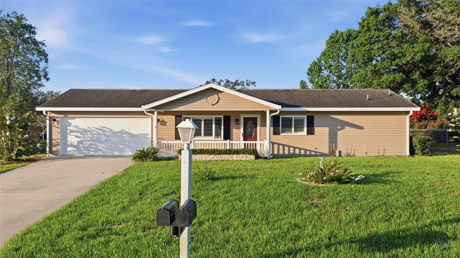 Premium upgrades throughout! Welcome home to this 2 bedroom, 2 bath, 1,008 sq ft under heat and air beauty in sought after 55 plus Spruce Creek North in Ocala on a .26 of an acre lot. The updates are what make this one super special. Every surface has been remodeled and meticulously maintained. MOVE IN READY. NO CARPET - Luxury Vinyl Plank throughout. Recently added built-in electric fireplace is a gorgeous focal point of the living room. PLANTATION SHUTTERS throughout. Fully remodeled kitchen - white shaker cabinets, high end quartz countertops, stainless steel appliance suite, undermount farmhouse sink and stylish backsplash. Both bathrooms have had a full remodel as well both with white shaker cabinets and gorgeous marble countertops. The guest bath features a tiled tub/shower combo and the primary bath a tiled step-in shower. both with safety rails.  All light fixures in home have been upgraded and both bedroom feature higher end ceiling fans with lights.  Sliders from the dining room take you out to a nice sized screened in lanai that has slate tile flooring, tile that matches the front porch of the home.  The primary suite features ensuite bath and walk-n closet. Other pluses to this home include - fenced in backyard, 2 car garage with EPOXY flooring and all shelving in garage is included in the sale. Newer washer and dryer, 2023 A/C, 2023 Electric Panel, 2023 Water Heater, All New Plumbing and Electrical, Roof is 2011 and in great condition and has been well maintained. This community features a low HOA fee and nice amenities to include swimming pool, clubhouse, loads of monthly activies and more. Convenient to shopping, medical and restaurants. Convenient to the State Rd 200 Corridor.