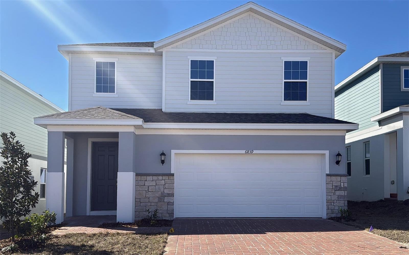 Welcome to the Wekiva, a beautifully designed two-story home by Trinity Family Builders that perfectly blends style, comfort, and functionality. Offering 4 spacious bedrooms, 2 full bathrooms, and 1 half bathroom, this thoughtfully crafted floor plan provides plenty of room for both everyday living and entertaining.

The heart of the home is the expansive kitchen, featuring abundant counter space and a layout that seamlessly connects to the dining area and family room, creating an open and inviting atmosphere. Upstairs, a generous flex gathering space offers endless possibilities, whether used as a media room, play area, home office, or secondary living room.

The private owner's suite serves as a relaxing retreat, complete with a large walk-in closet and a spa-inspired bathroom featuring Trinity's signature Luxury Retreat Shower. Three additional bedrooms provide comfortable accommodations for family members and guests alike.

Step outside to enjoy the covered rear lanai, ideal for outdoor dining, morning coffee, or simply enjoying Florida's beautiful weather. Additional highlights include Trinity's exclusive Package Place, a secure built-in outdoor storage and package delivery area equipped with a dedicated delivery door and electronic keypad lock for added convenience and peace of mind.

Designed with modern living in mind, the Wekiva offers exceptional living spaces, elegant finishes, and the quality craftsmanship Trinity Family Builders is known for.