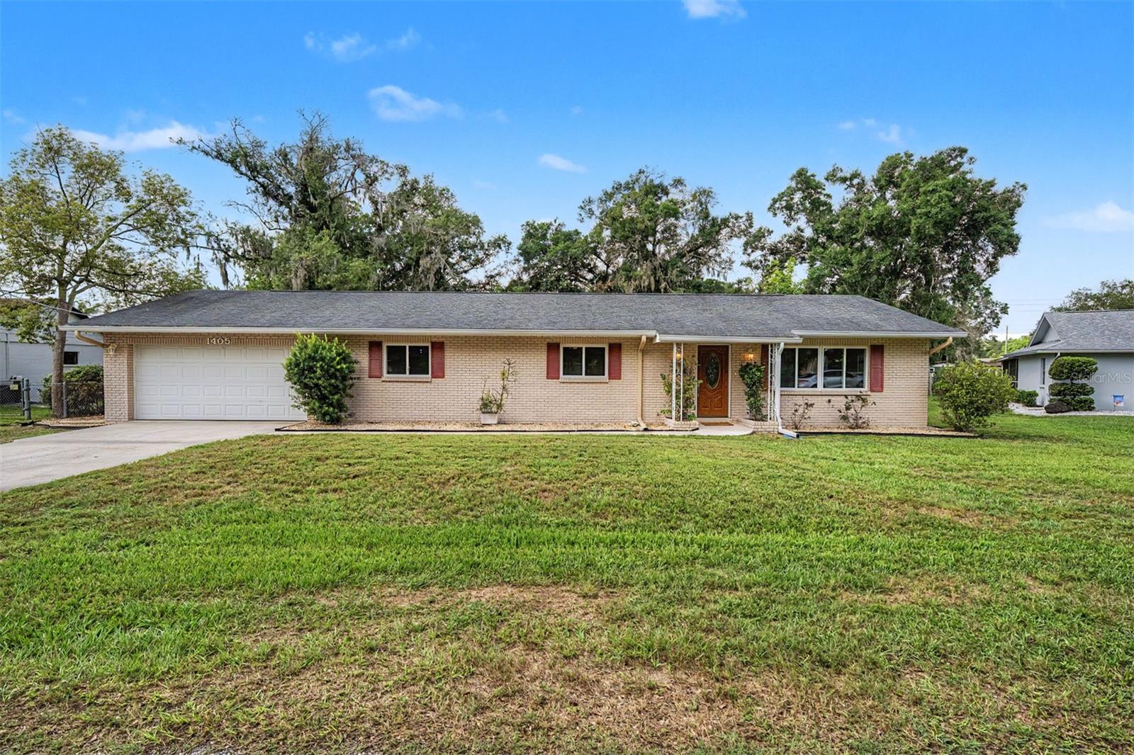 BRING YOUR BOATS AND BRING YOUR TOYS! NO HOA or CDD, this WATERFRONT home nestled on 0.34 acres in Keene Lake Manors with LAKE ACCESS to Keene Lake in the heart of Lutz is a RARE find! With 3-bedrooms + flex room, 2 bathrooms, and a 2-car garage, this home has it all! Upon entering, light shines through the freshly painted (2026) open floor plan living, dining, and kitchen. Stepping inside your moody primary retreat, with rich plum walls and newer LVP dark wood flooring (2022), this spacious bedroom is designed to be a true escape. Fully equipped with a walk-in closet with custom shelving and its own en-suite bathroom, this is the kind of room you won’t want to leave. The kitchen boasts wood cabinets, granite countertops, an additional pantry, and newer stainless-steel appliances (oven and dishwasher 2022), all overlooking the sunroom and patio with water views. The remodeled sunroom (2023-2024) offers a speakeasy-inspired charm, with a newer, dramatic ceiling and warm lighting (2022). You’ll find it the perfect space to connect with others, get cozy with a good book, or simply watch the abundant wildlife. Bedroom three blends English library charm with newer LVP wood flooring (2022), botanical wallpaper, detailed crown molding, and a vintage-style chandelier (2024); this room is perfect for a home office, reading room, and so much more. Some additional upgrades include IMPACT WINDOWS AND DOOR THROUGHOUGHT (2020), WATER SOFTENER SYSTEM, and a NEWER SEPTIC AND DRAIN FIELD (2019).  Stepping outside, the fully screened-in patio was added in 2020, overlooking your FULLY FENCED IN BACKYARD, with canal views, leading to the 30-acre and private Lake Keene. A boat dock can easily be added, with the structure there to add one. The home itself is also in Flood Zone X, so no flood insurance is required. Jen Ma Jo is a quiet, dead-end street with quick access to US 41 and I-275 heading south to Tampa. FL-54 is a short distance away, where you will find endless shopping, food, and more. This RARE gem offers country living while being close to all that Tampa has to offer. What are you waiting for? SCHEDULE TODAY!!