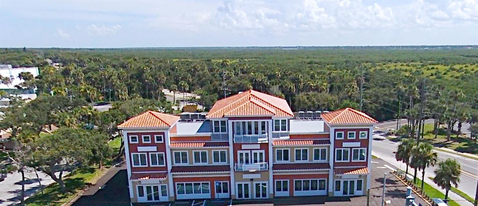 Rooftop Loft overlooking of the heart of the city.  Don’t miss this unique opportunity to enjoying stylish modern living in this immaculate NSB Penthouse. Truly one of a kind, this rooftop Loft is not your average apartment offering 3 bedrooms and 3 full baths and is move is ready.  This space, which is accessed by private elevator, offers a large bright living room with built in dry bar and features elegant French doors that lead out to the amazing wrap-around rooftop patio that offers a birds-eye view our charming beach town. The open kitchen is a chef’s dream come true.  It offers an easy to work in design, gorgeous custom backsplash, a lot of storage space, Stainless Steel appliances with double oven and a sleek curved quarts breakfast bar that seats up to 6 and overlooks the living room and offers more views of the city. The master suite boasts private access to the roof, a huge walk-in dressing closet and is complete with the master bath with step in shower with separate lavatory.  In addition to its breathtaking views, the massive high-top patio offers additional storage and plenty of space where you can create an intimate private oasis while you enjoy the convenience of nearby dining, entertainment and shopping, and of course, the glistening shores of the Atlantic Ocean.