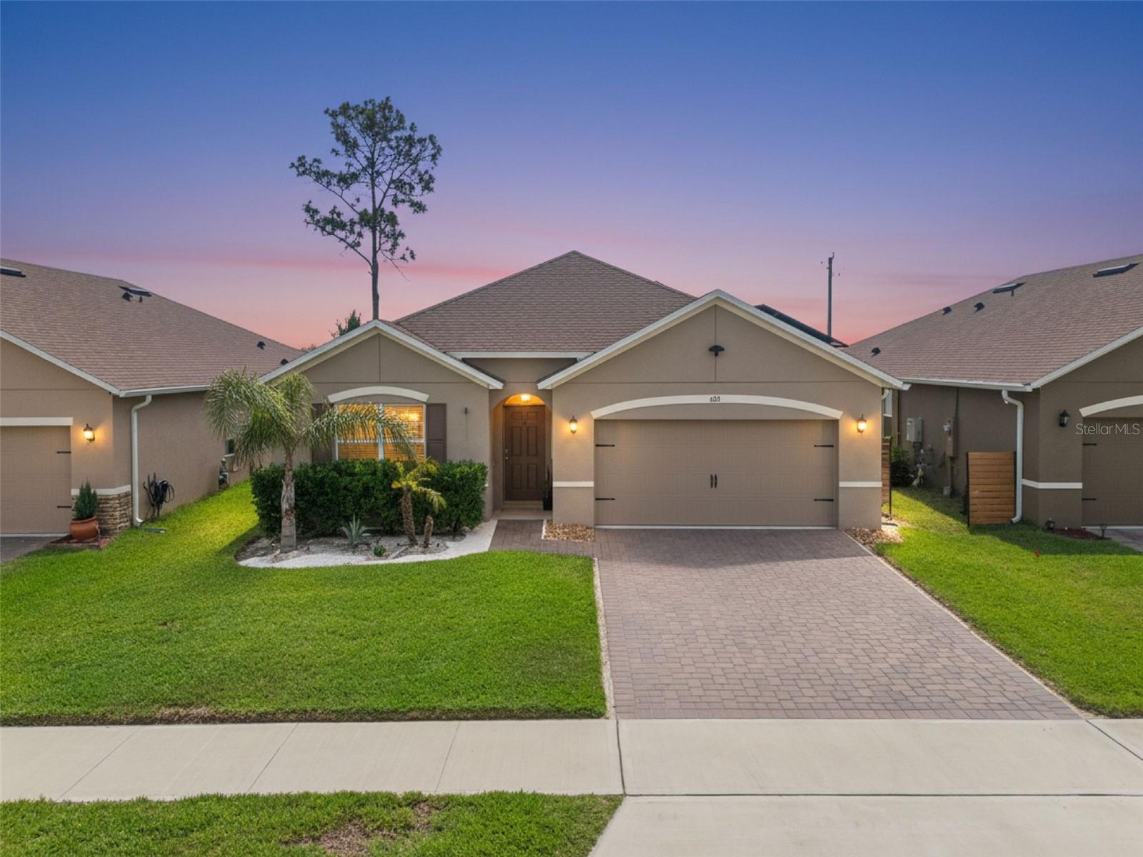 Energy-efficient living meets private backyard relaxation at 623 Lazio Circle, a beautifully maintained 2023-built home in DeBary’s gated riverfront community of Riviera Bella. This home features solar panels, giving the next owner the opportunity to benefit from improved energy efficiency and help offset rising utility costs from day one. A brand-new luxury Jacuzzi hot tub is also included, creating a private outdoor retreat where you can unwind, entertain, and enjoy the Florida lifestyle right at home.
Offering 4 bedrooms, 2 bathrooms, 1,836 square feet of living space, and a 2-car garage, this home combines newer construction convenience with thoughtful details throughout. From the moment you arrive, the home delivers strong curb appeal with manicured landscaping, paver driveway details, exterior lighting, a Ring camera, and the added benefit of no home directly in front, creating a more open and private feel.
Inside, you are welcomed by tile flooring throughout the main living areas, two-panel interior doors, a coat closet upon entry, and a bright open-concept layout designed for everyday comfort and easy entertaining. The kitchen features granite countertops, a natural gas range, walk-in pantry, stainless steel undermount sink, and generous prep and storage space, making it both stylish and functional for daily living.
The main living area is enhanced by a custom panel-detailed accent wall, creating a beautiful focal point. Sliding glass doors lead out to the patio and privacy-fenced backyard, where the brand-new luxury Jacuzzi hot tub creates the perfect place to relax after a long day. Backing to an empty lot, the outdoor space offers added privacy and a peaceful setting for quiet evenings, weekend gatherings, or enjoying the Florida sunshine.
The primary suite offers a spacious retreat with dual vanities, a walk-in shower, private toilet closet, and custom built-ins in the primary closet for elevated organization.
Located in Riviera Bella, residents enjoy a resort-style lifestyle with a gated entrance, clubhouse, pool, fitness center, playground, splash pad,  park, picnic areas, and private community boat ramp with access to the St. Johns River. This golf cart-friendly community makes it easy to enjoy the neighborhood lifestyle, with boating, outdoor recreation, and local favorites nearby. Just minutes away, DeBary Golf & Country Club offers golf and a social club atmosphere, while Swamp House Riverfront Grill is a beloved waterfront spot with laid-back live music and strong local following.
The community is ideally positioned near the DeBary SunRail Station, I-4, Lake Mary/Heathrow, local dining, shopping, golf, and the outdoor recreation that makes the St. Johns River lifestyle so desirable.
With solar panels, a brand-new luxury Jacuzzi hot tub, privacy fencing, designer touches, and a prime Riviera Bella location, 623 Lazio Circle offers the perfect blend of comfort, efficiency, and resort-style living. 

Schedule your showing today. Use our preferred lender and receive up to $2,000 toward closing costs. Purchase this home and if YOU are not satisfied, we’ll SELL IT FOR FREE!* First responders and military members ask about our appreciation discount. Exclusive VA 0% down financing available for those who qualify, plus rate buydown options available.
Move up to this home and we’ll buy yours subject to conditions.
For more information on these exclusive offers, contact the listing agent directly below.