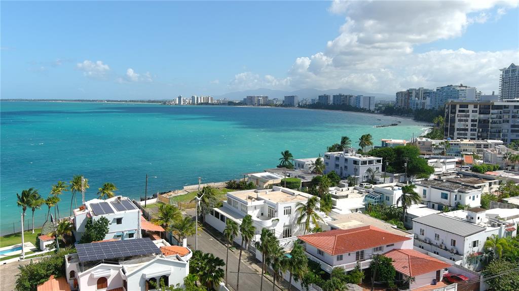 Unique once in a lifetime opportunity to have the privilege of owning one of San Juan's fewer than 70 houses that are oceanfront. Perfectly situated in one of San Juan's most exclusive 24 hour gated communities and directly in front of the ocean, this 1528sm double lot property has the most majestic coastal views imaginable. The property features two separate contiguous lots***. Delight in customizing these 2 properties and making your dream home. The first home sits on a 750sm lot boasting a beautiful colonial residence of approximately 5000sf featuring a foyer, large living and formal dining rooms, an adjacent great room with cathedral ceilings, a splendid oversize library with office and a bathroom , a huge bedroom on the first floor, a laundry room, and a maid’s room with a bath . There are three (3) additional bedrooms with gorgeous ocean views from the second story, all with baths.  The master bedroom has 2 huge walk in closets. The adjacent oceanfront home is a diamond waiting to be polished or renovated, sitting on a 778 square meter lot with 5 bedrooms. It could be used as a separate home or integrated to the previously described residence, as an additional guest house which could potentially create a unique majestic estate like no other on the limited oceanfront coast of San Juan with over 1528 square meters.  In addition both houses have solar panels on the roof. The Punta Las Marias area has long been an exclusive local neighborhood and it's living a revival as many homes are being renovated or newly constructed. It is near many restaurants, top private schools, and beautiful beaches. With the ocean right in front of your house, you have access to aquatic sports such as surfing, paddle boarding, fishing, windsurfing,swimming and a lifestyle like no other. 
***Oceanfront home 778 sm sold separately for $3.2M and contiguous residence 750sm for $3M.