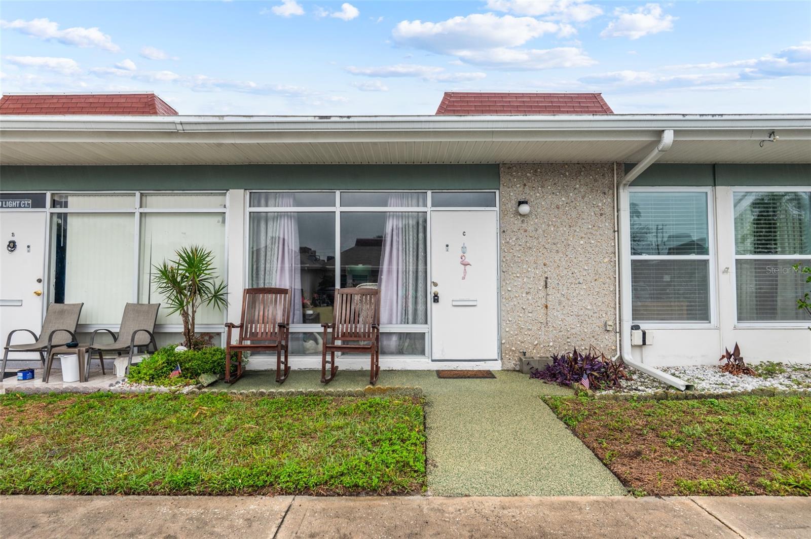 HIGHLY Desirable & GATED, Tahitian Gardens 55+ Community, located right along US-19. Move-in ready, FIRST FLOOR CONDO!! Nobody above you or below you!! Competitive and LOW Monthly Fees!! 2 bed, 1 bath with 825 square feet of living space. Roof 2017. Water Heater 2023. Enjoy a seamless move-in experience—this CONDO can be offered with furnishings. Welcome to Tahitian Gardens, a well-kept gated 55+ community designed for easy living, convenience, and a vibrant social atmosphere. The HOA takes care of exterior maintenance, allowing for a low-maintenance, carefree Florida lifestyle. Conveniently located just minutes from Gulf beaches, the Tarpon Springs Sponge Docks, shopping, dining, and public transit, this condo offers exceptional access to everything in this area. Nice front patio—perfect for enjoying your morning coffee or connecting with neighbors. Residents of Tahitian Gardens enjoy a welcoming, walkable environment with a variety of amenities, including a heated pool, shuffleboard courts, billiards, a clubhouse with kitchen and gathering spaces, and scenic walking paths around a tranquil lake with a fountain. A full calendar of activities—like bingo, card games, crafts, and biking—ensures there’s always something to enjoy.