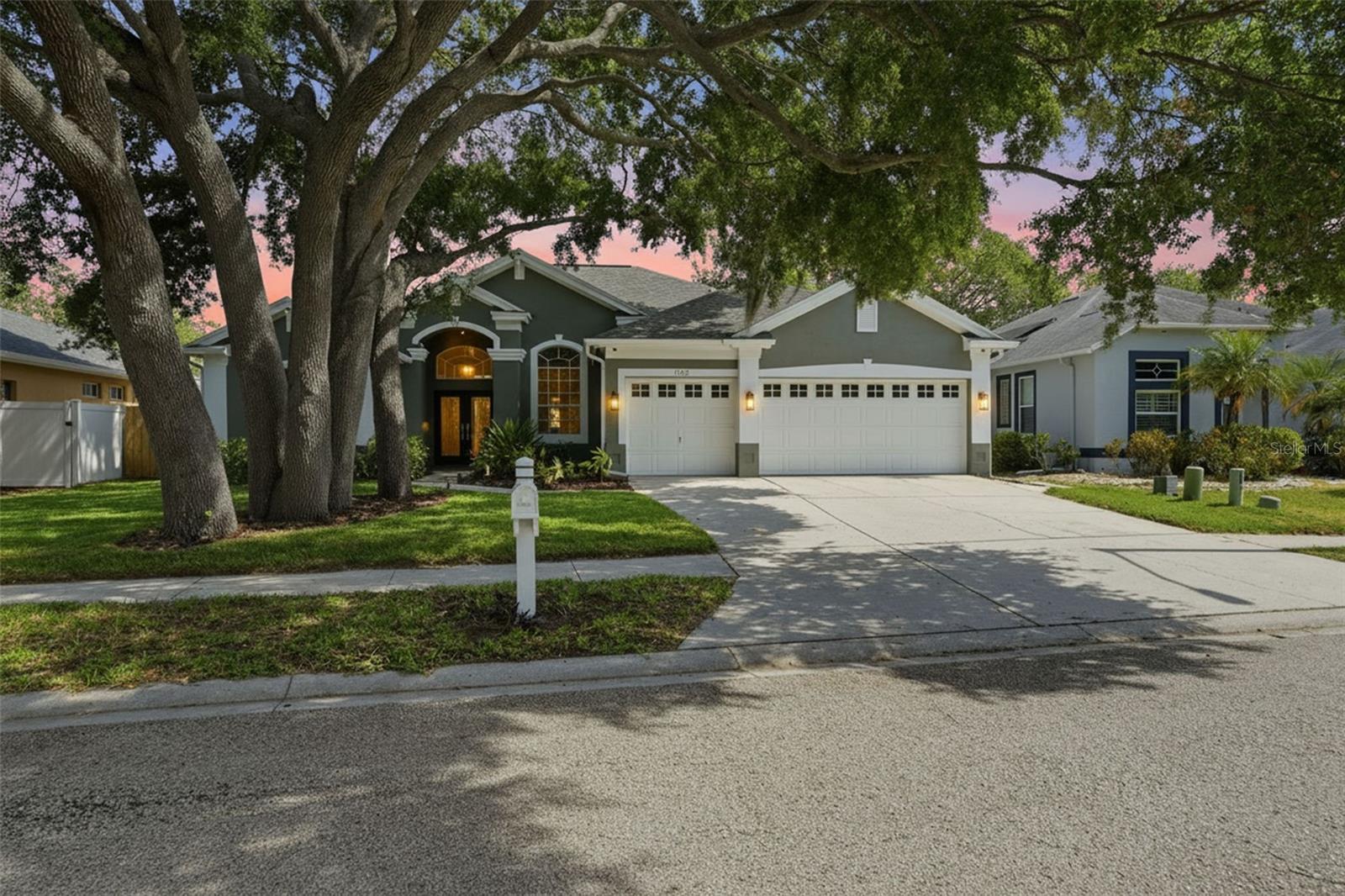 Virtually Staged. Wow factor! Totally renovated executive pool home with water access in desirable River Watch community. Perfectly positioned high and dry overlooking the scenic Anclote River with no flooding during the 2024 storms. Completely updated with high style and fashionable finishes… enter through fabulous, mahogany leaded glass double doors to true open concept living with magnificent updates from new engineered wood flooring to soaring ceilings! Formal living and dining areas lead to the chef’s kiss kitchen that has been updated with high style. Gorgeous brand-new cabinetry with fogged glass toppers, crown molding, pan drawers and an accent island all topped with quartz counters and finished with designer hardware and backsplash. Be the first to use the all-new appliances including a gas convection oven, dishwasher and French door refrigerator! A convenient breakfast bar opens to the main living area and a sizable eat in space all looking out on the beautiful pool, patio oasis and on to the river view! The primary bedroom is sizable and offers trey windows to bring a sunny ambiance. It houses an enormous walk-in closet with custom closet system and a spa-like ensuite bath that has been renovated with designer tile work and upscale finishings. The ensuite boasts a split double vanity, water closet and an impressive walk-in shower with indulgent shower head and fixtures! The secondary bedrooms are sizable with ample closet space and both feature new carpeting. The second bath has been updated with the same elegant styling as the rest of the home. Even the laundry room is a site to behold with abundant cabinetry, utility sink and chic tile flooring. The outside extended living space is paradise! Beautiful pool and covered patio screened for ultimate comfort and an additional open patio area with endless possibilities. Enjoy Florida living at its finest… privacy, serenity and picturesque views. This rare gem is situated in a non-flood zone with no flood insurance required. The River Watch community delivers the ultimate Florida lifestyle with a community boat ramp allowing Gulf access via the scenic Anclote River and through historic Tarpon Springs Sponge Docks! This home is truly move in ready and an absolute must see!