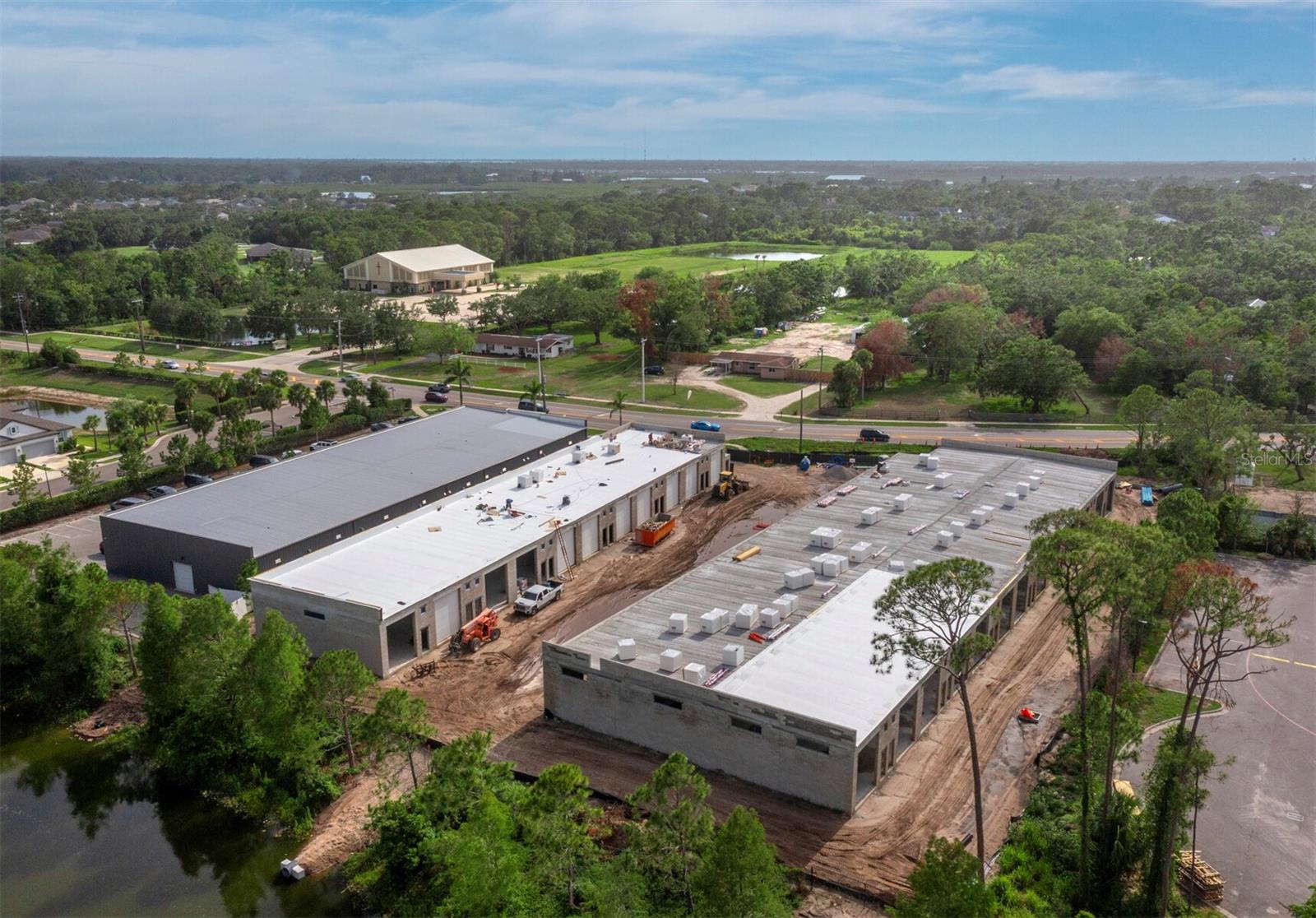SR 64 EXECUTIVE STORAGE is a brand new, climate-controlled facility for the ultimate Car, RV, and Boat enthusiasts. Conveniently located off SR 64 and west of I75, the location is an easy drive from downtown Sarasota, Bradenton, and all the barrier islands. A safe and secure community comprised of 36 total condominiums, each individually owned. Many of the construction components are Hurricane Impact Rated per Miami-Dade Standards (CAT5) with concrete block and steel reinforcing using a high level of all construction materials. Each garage condo has a motorized 14' H x 12' W garage door with remote and keypad, separate pedestrian entrance, half bathroom, concrete floors, 16' ceilings, and more. Low association fees include water, and each unit is individually metered for electric. Safely store your most valuable assets, away from the storm surge possibilities and salty air. For those living on the islands and close to the water, your garage condo will provide shelter when you need to evacuate.