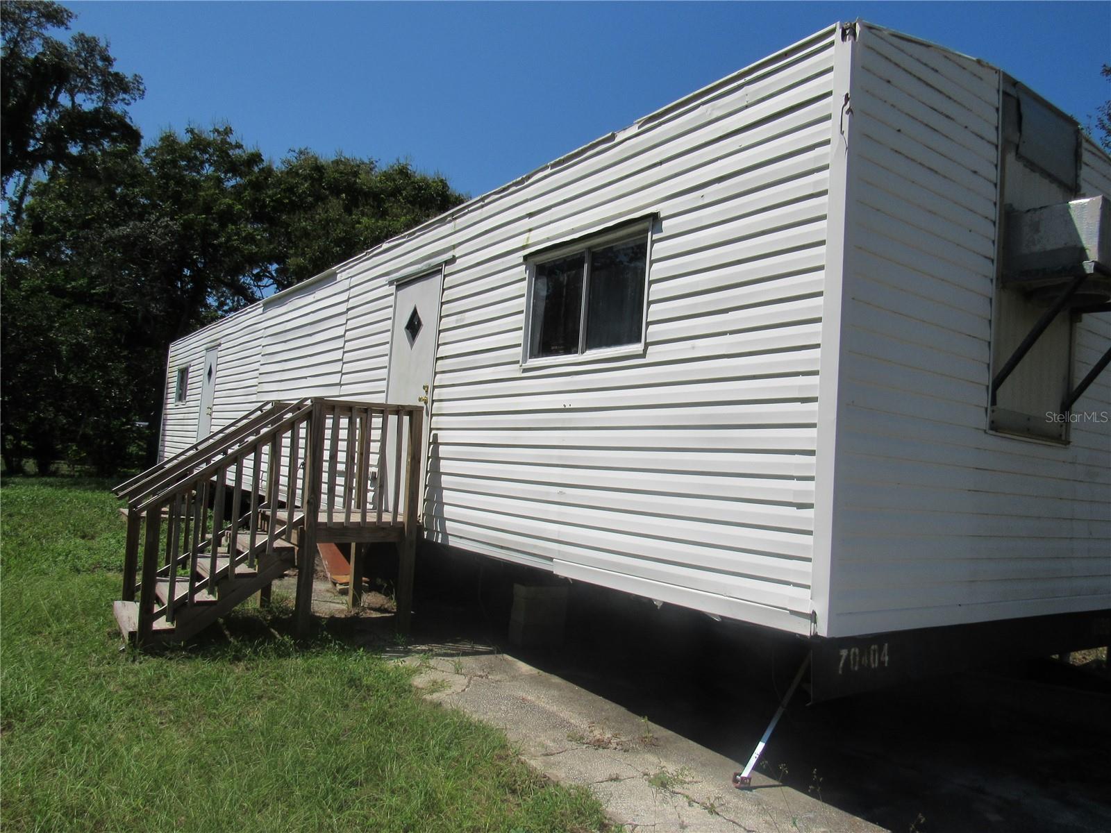 Want to enjoy the quiet of Country living but be only a few miles from Ocala?  1997 single wide mobile home offers 3 bedrooms and 2 baths along with an extra large patio outside.  Built-in storage throughout, open concept floorplan.  Kitchen has lots of cabinet space, double sink and modern appliances. Master bedroom and bath featuring a step in shower.