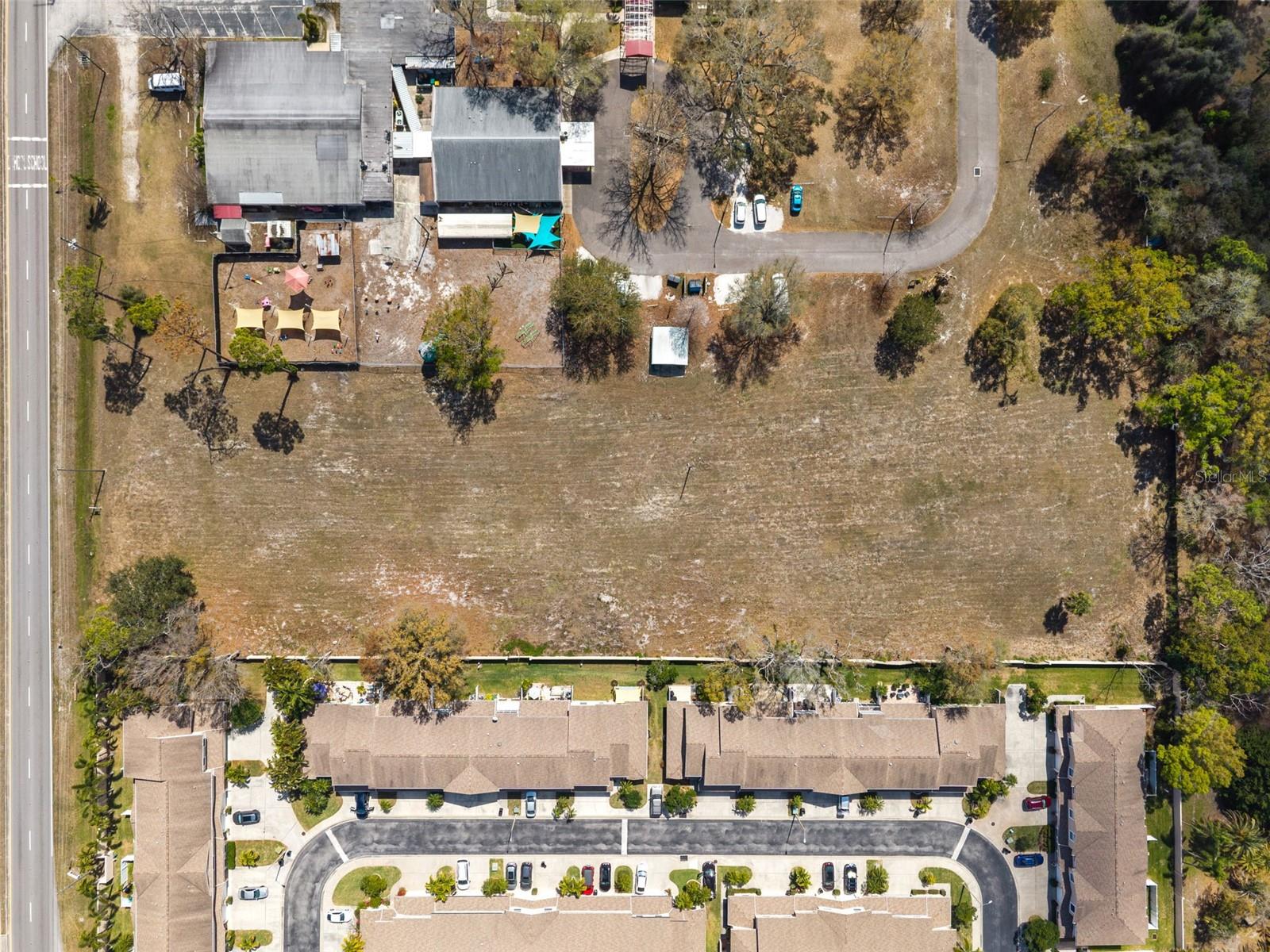 RARE PINELAS COUNTY DEVELOPMENT OPPORTUNITY! Introducing the Starkey Road 29 Townhomes project. This project consists of 2.3-acre site which is cleared and will be delivered fully entitled and approved. The project features 29 exquisite 3 to 4-level luxury townhomes (approx. 45ft height) and a reinforced steel auto storage facility for 35 climate-controlled garage lofts with lifts—a massive market differentiator for car collectors and high-end buyers.

INVESTMENT HIGHLIGHTS:
Fully Entitled: Delivered with approved rezoning, civil engineering, surveys, and architectural renderings.
Unique Design: 3-4-story units featuring 1st-floor primary suites, expansive 2nd-floor living/kitchen areas, and 4th-floor penthouse suites with private 300 SF rooftop decks.
Total Flexibility: No HOA, Bylaws, or Covenants have been established yet, allowing the developer to control management fees and determine short-term vs. long-term rental policies to maximize ROI.
Upside Potential: Site plan allows for changes; explore the "Live Local Act" or affordable housing routes to potentially increase density.
Amenities: Approved for a resort-style pool, gazebo, dog park, lush tropical landscaping, and gated security access.

Develop and sell individual units with deeded garage spaces or hold this Class-A asset for long-term cash flow and appreciation. Shown by appointment only. NDA required for OM, Proforma, and full architectural sets.