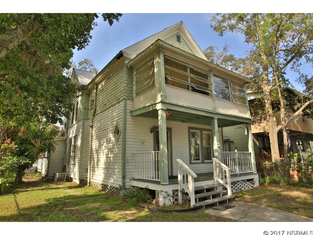 VINTAGE 1915 HISTORICAL HOME located in the heart of N.S.B.'s business district, close to Canal Street between the Intracoastal Waterway and U.S.1.   Three bedrooms, 1 1/2  baths with a large welcoming Southern Style front porch to relax on & watch the world go by! The main floor features a grand foyer, a spacious island kitchen with Stainless Steel appliances and plenty of sunlight, a  formal dining room, one bedroom, 1/2 bath and the living room. Heading up the wooden staircase you will find 2 bedrooms and a full bath.  This home is spacious and offers Mixed Use Zoning which provides opportunities for residential, multi family, studios, galleries, small businesses and more. Sunny backyard deck off the kitchen, detached one car + garage off the back alley. Metal roof. Outdoor shower.  If you are looking for an old style Florida home and want to be close to downtown with a short walk to the river, you may have just found the perfect place to call home!All information is believed to be accurate but is not guaranteed. Buyers and their agents should verify all information deemed important to them. ;Water: City