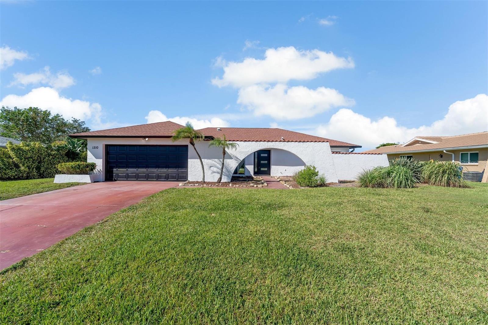 Welcome to 1210 68th Street W, your dream home in the heart of Bradenton, Florida! This newly renovated gem seamlessly blends modern living with Florida's tropical paradise. Situated on a spacious lot, this property offers the perfect mix of comfort, convenience, and outdoor leisure. The open floor plan provides endless possibilities for interior design. This home has been completely remodeled, featuring brand-new vinyl floors, renovated bathrooms, and a kitchen that steals the show with solid wood cabinets, quartz countertops, and brand-new stainless steel appliances. The freshly painted interior and exterior provide a refreshing pop to the home. In the large two-car garage, you'll discover recently rerouted washer and dryer hookups and a newly finished garage floor. The Florida room at the rear of the house serves as a delightful space between the house and the poolside patio. Beyond the home, the location is fantastic, with easy access to restaurants, parks, shopping centers, and a short drive to all the nearby beaches making it an ideal spot to call home. Don't miss the opportunity to schedule a showing at 1210 68th Street W today. Your dream home awaits!